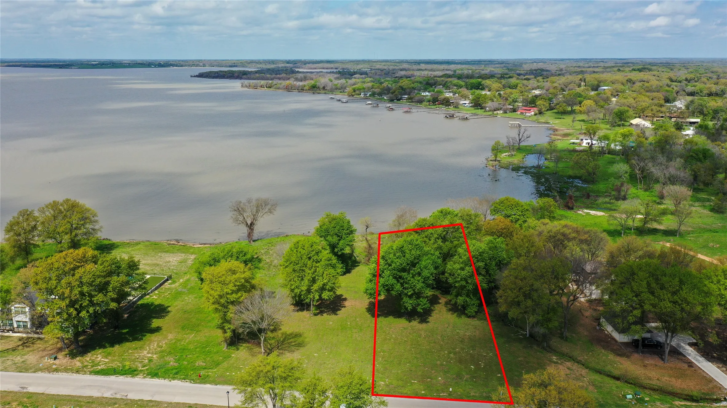 Almost half acre open water lot in gated community.