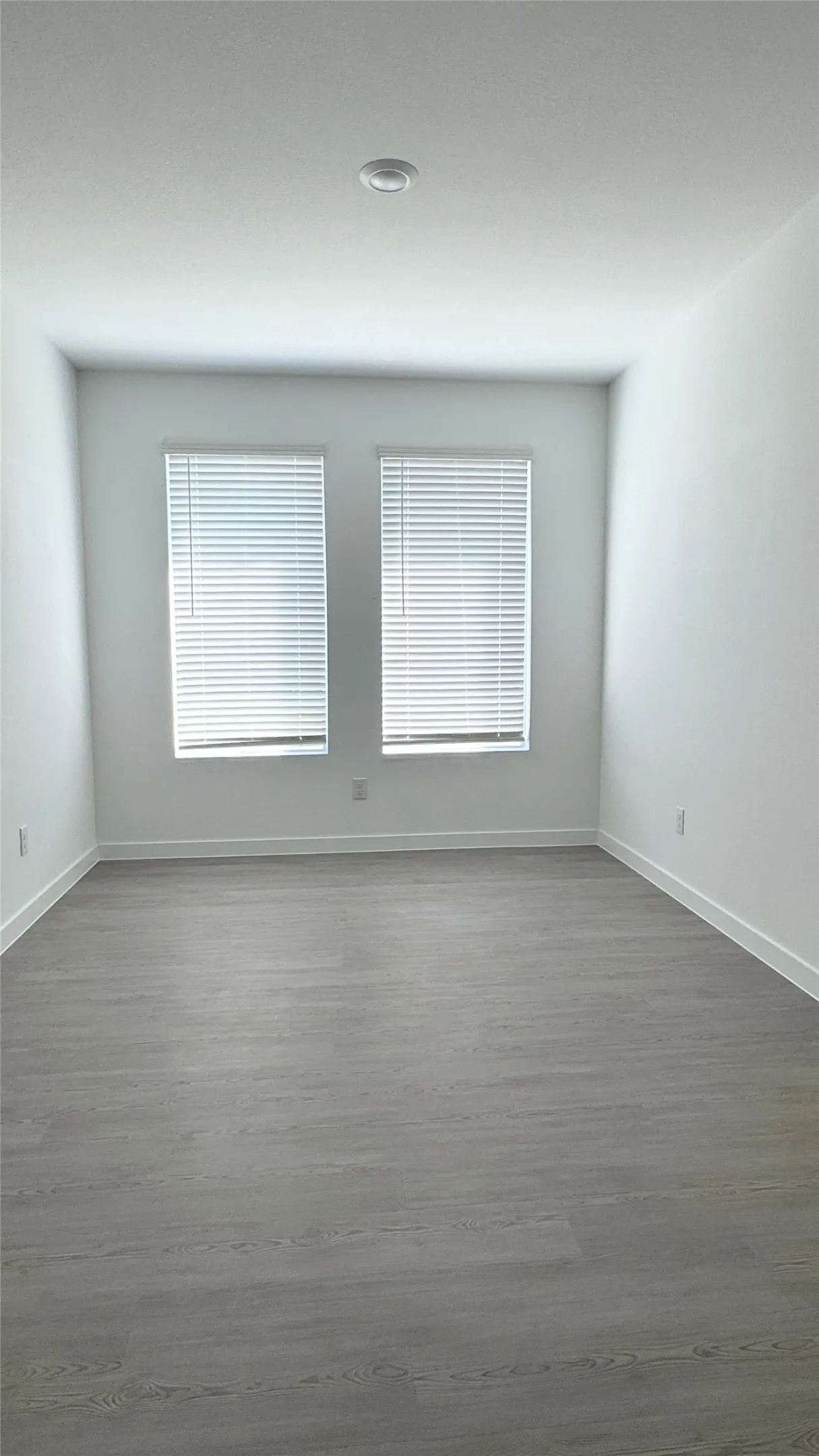 $th bedroom, game room, media room or office.  Wood-finish flooring with crisp white walls and dual windows