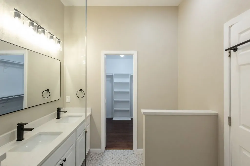Dual vanity with integrated sinks and matte black fixtures