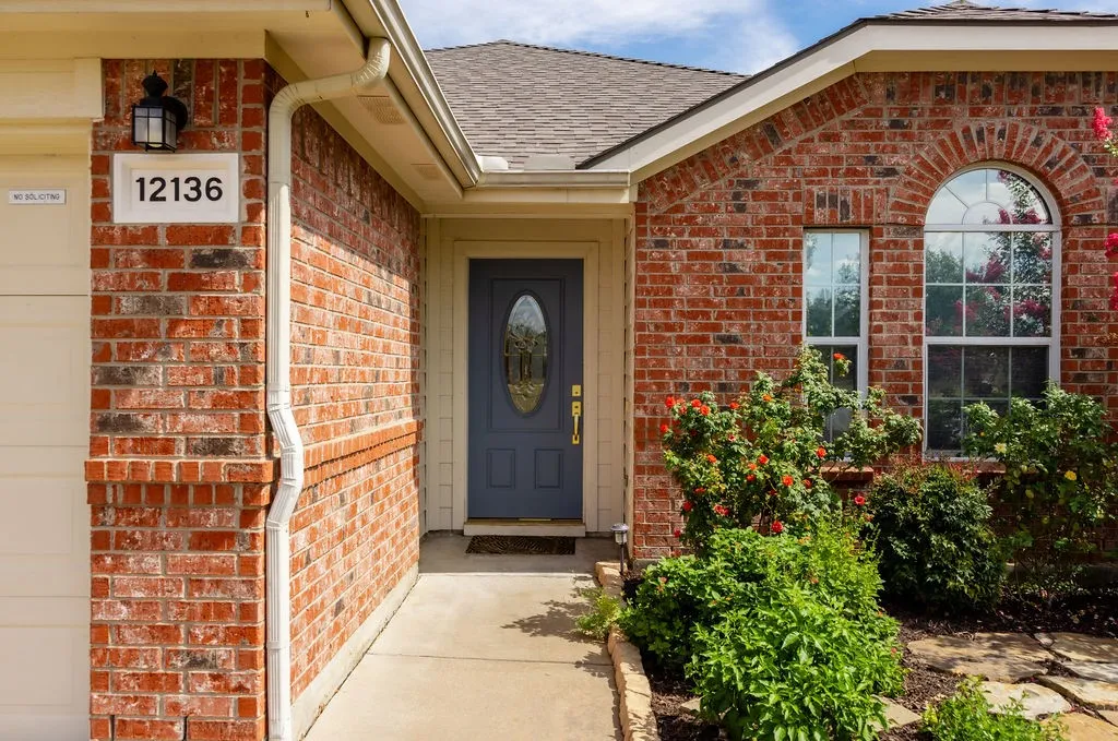 Red brick exterior with white trim