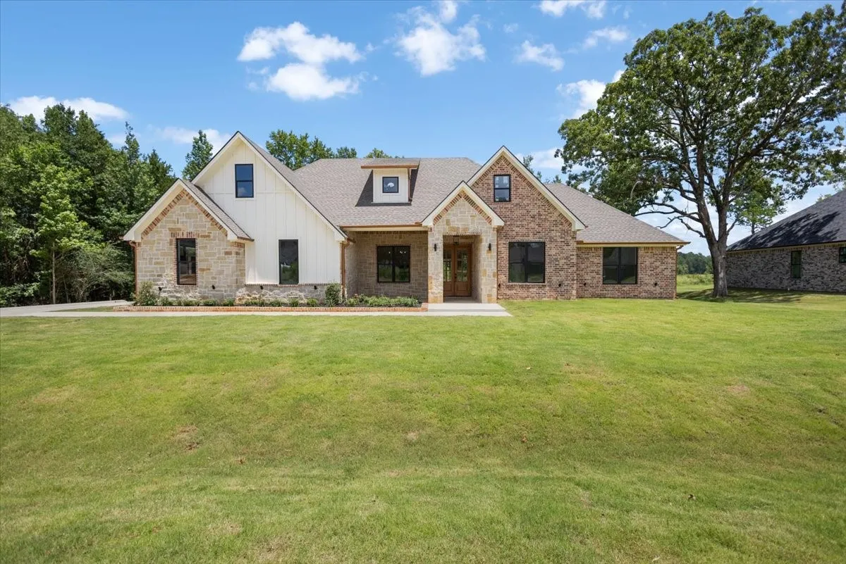Stone and brick facade with board and batten accents
