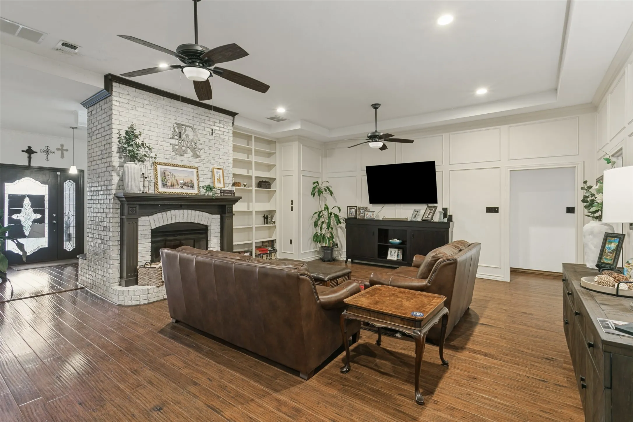 Living room is the central point of the house. Note the entryway to left and hallway to rear sleeping quearters