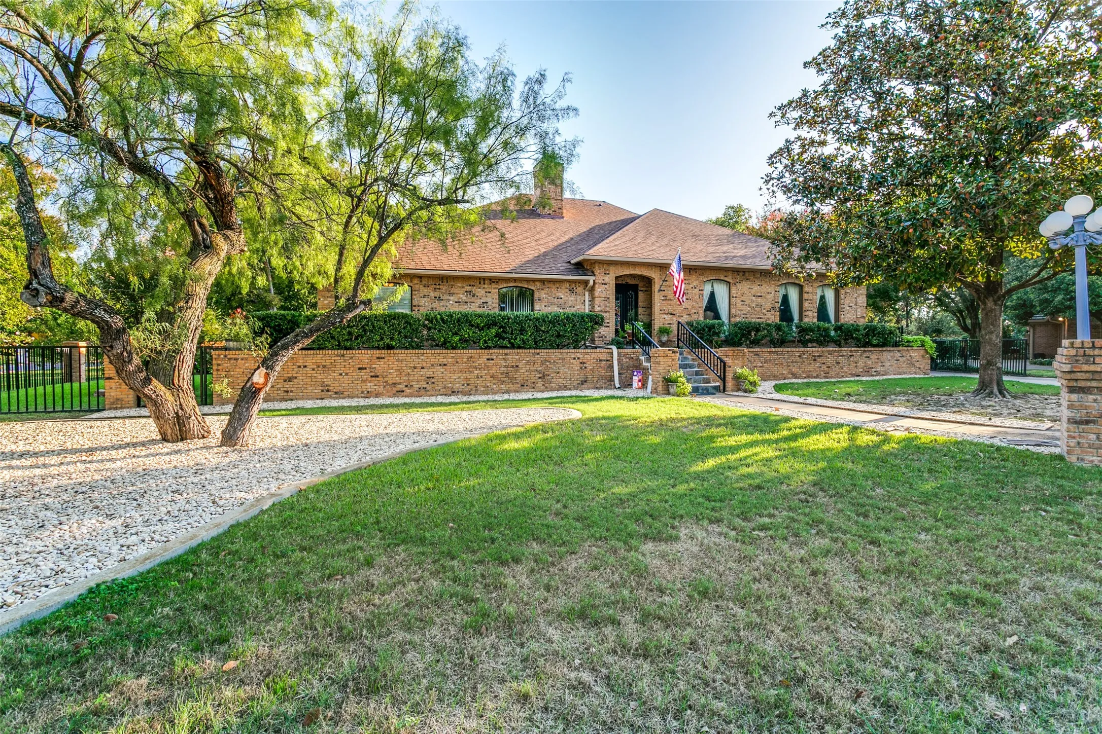 Well landscaped half acre yard with many trees