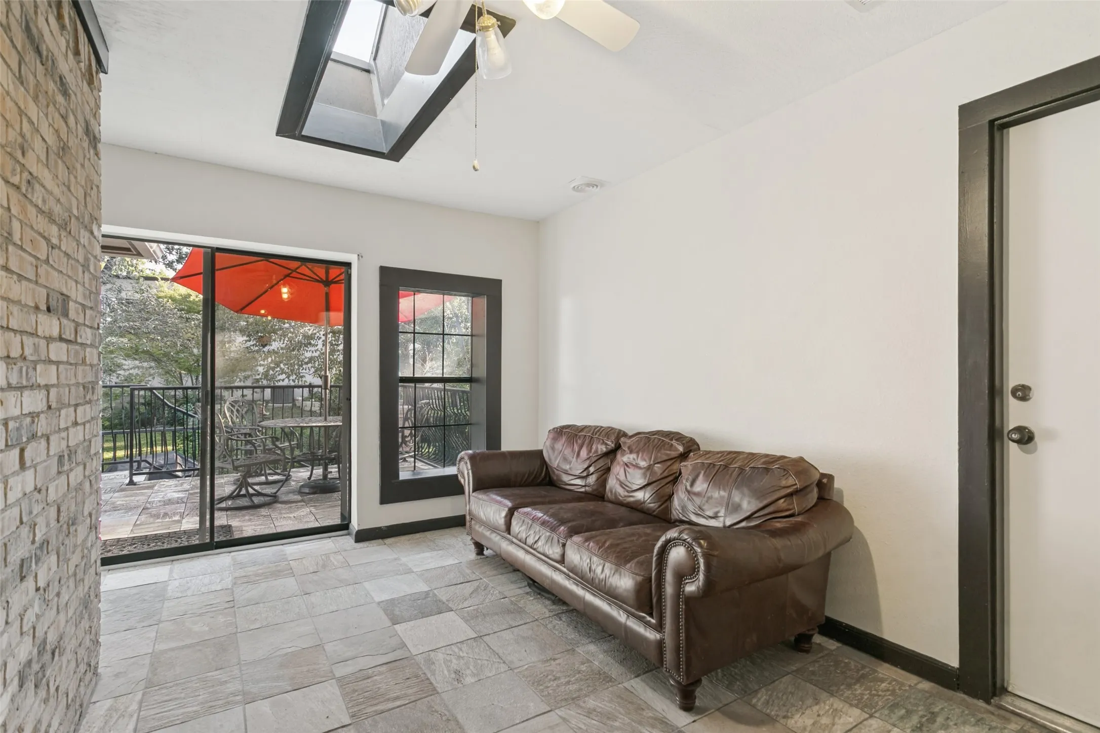 Solarium connects living room, garage and patio