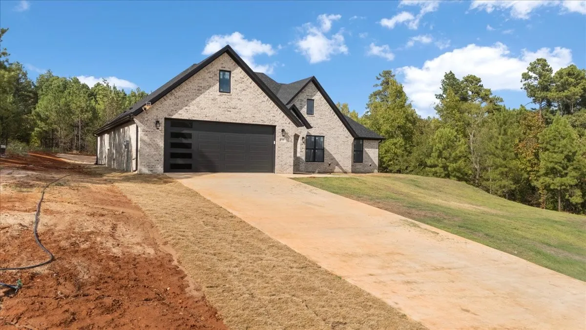 Light brick exterior with dark trim windows