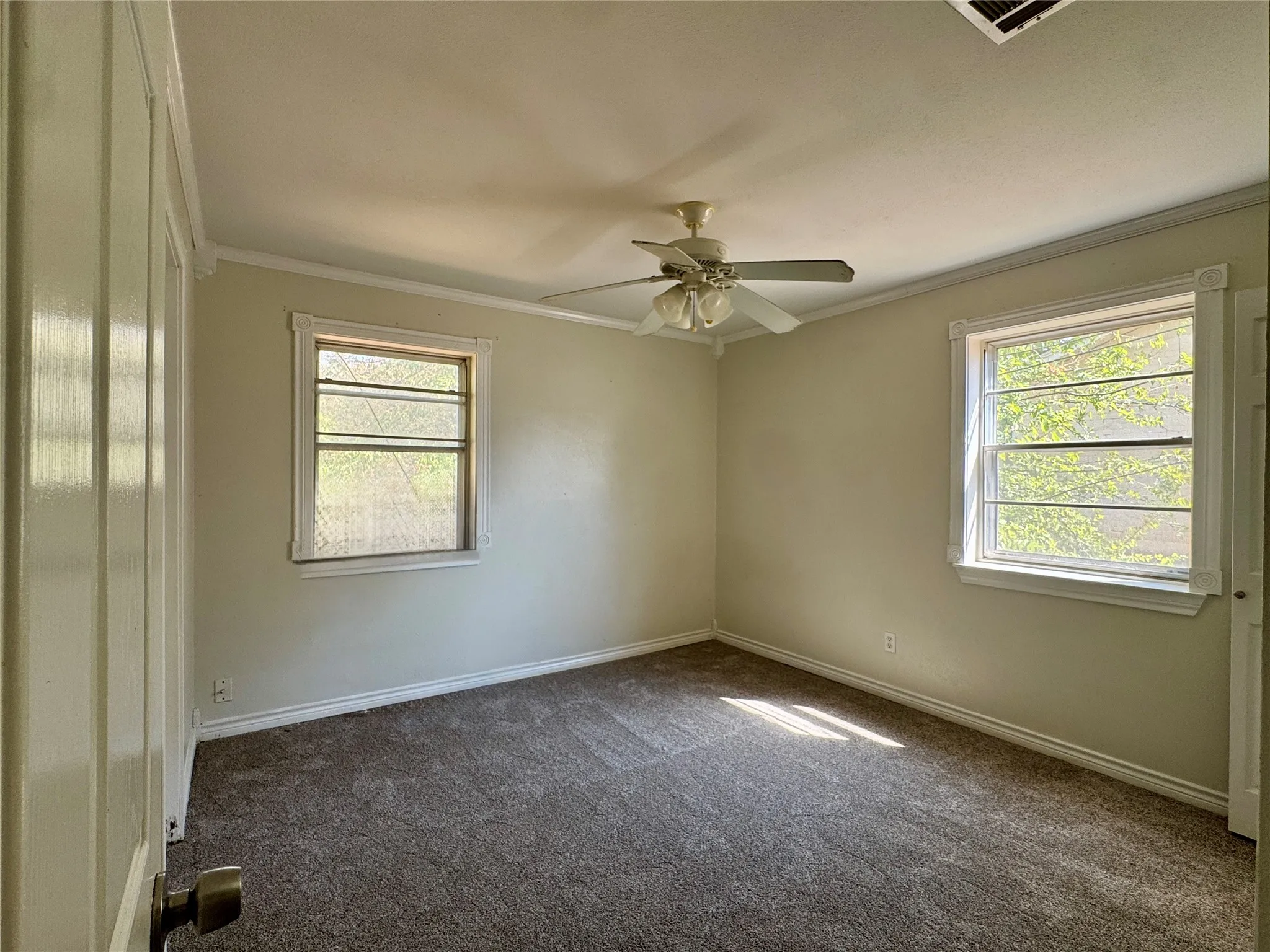 Neutral-toned walls complement the new, fresh carpeting