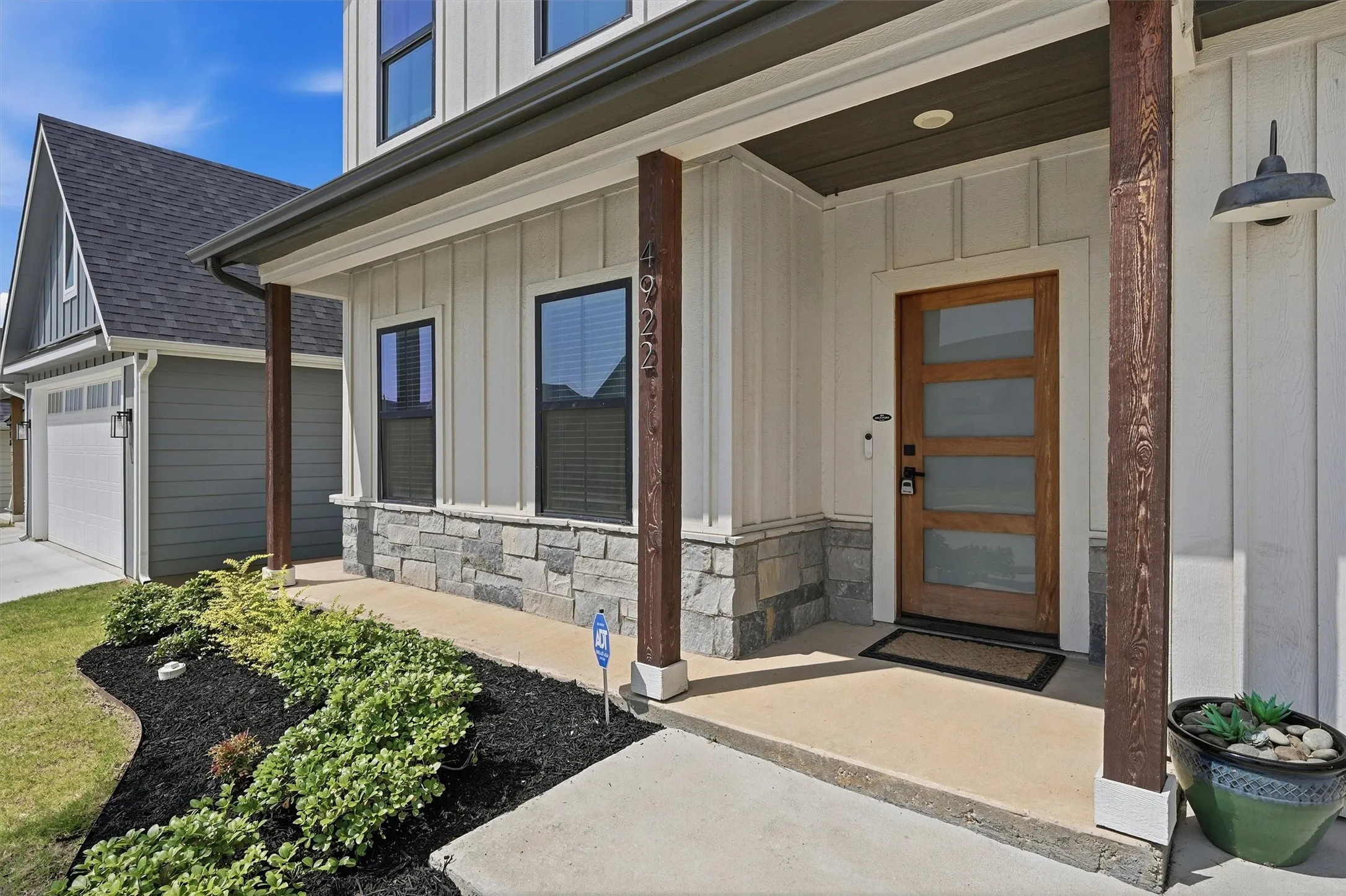 Board and batten siding with stone veneer accents