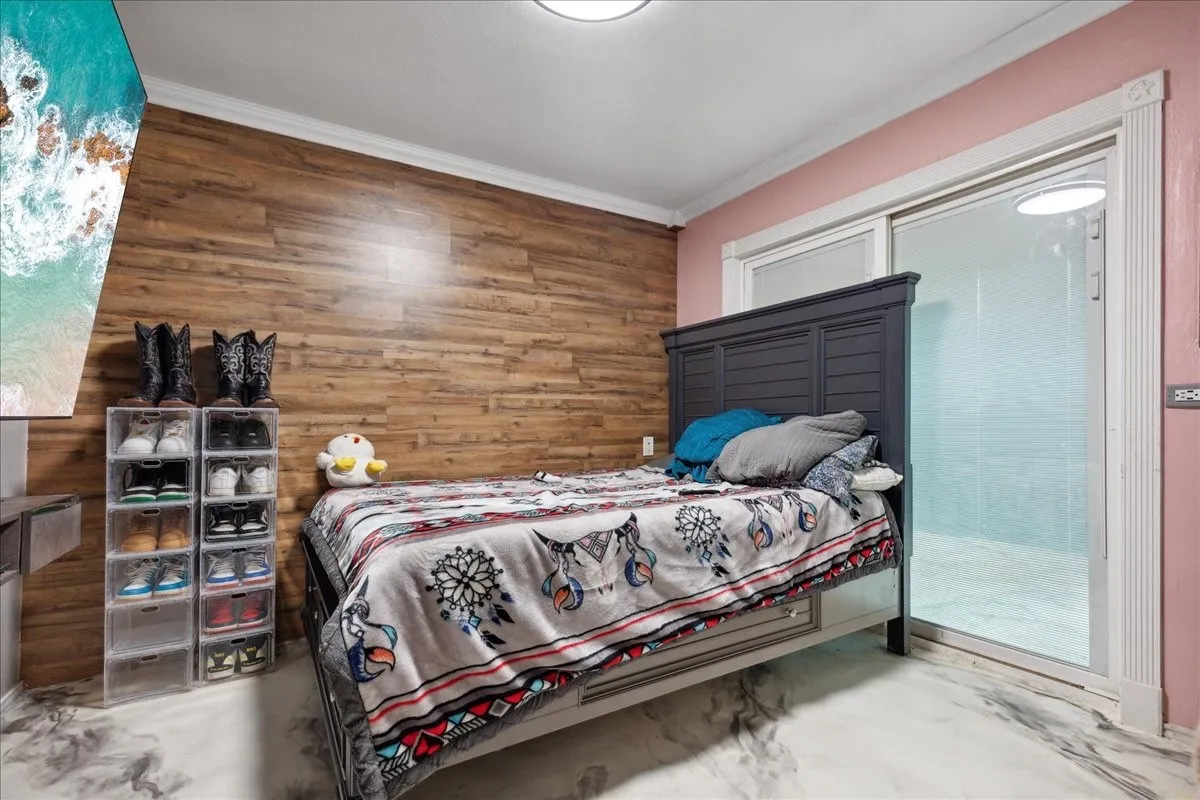 Wood-finish accent wall with crown molding