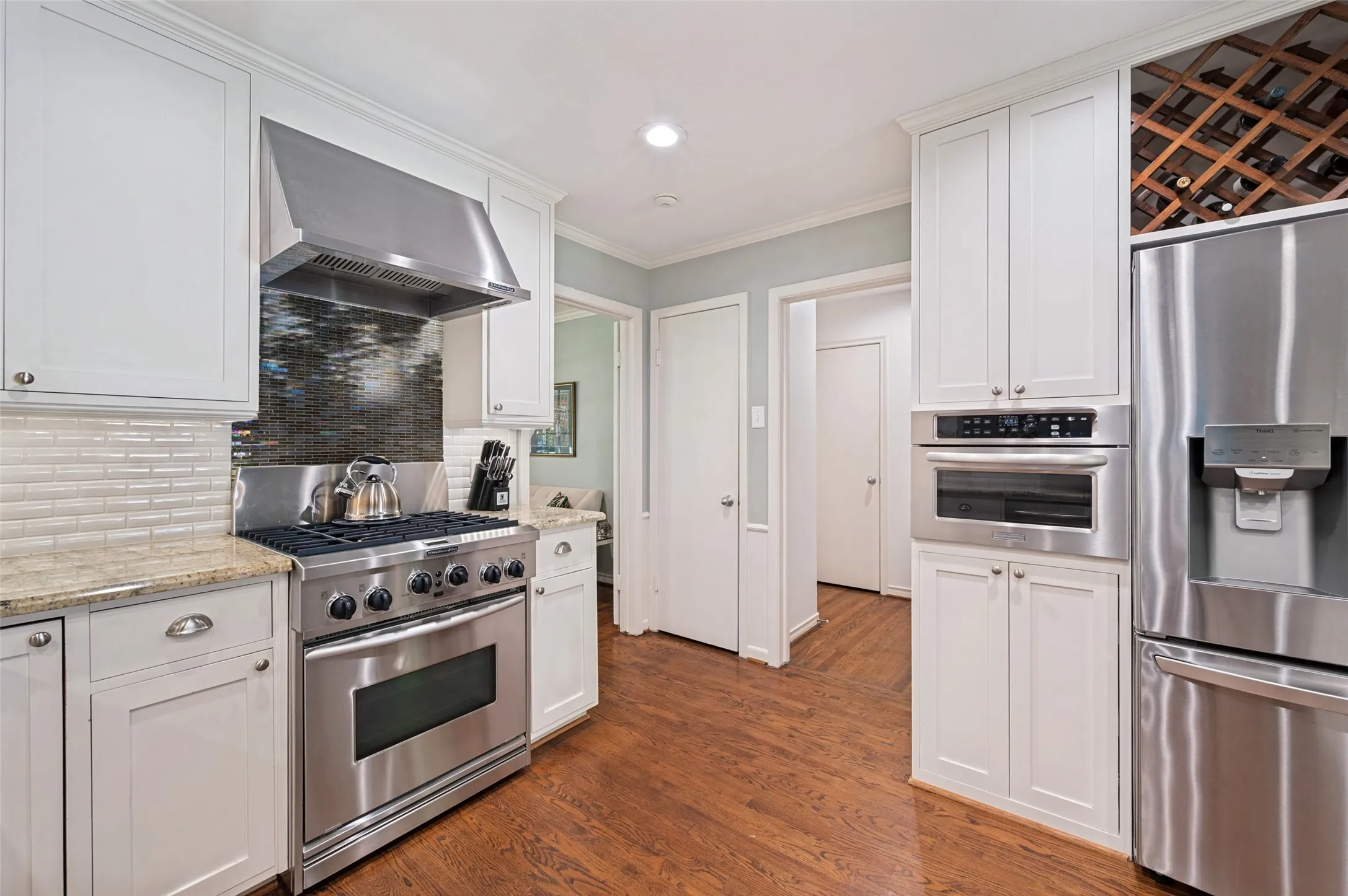 White shaker-style cabinetry with brushed nickel hardware