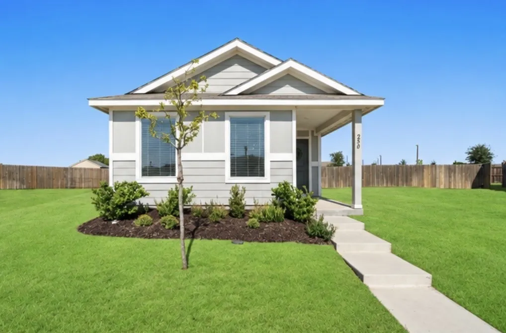 Single-story residence featuring light gray siding and a covered front porch