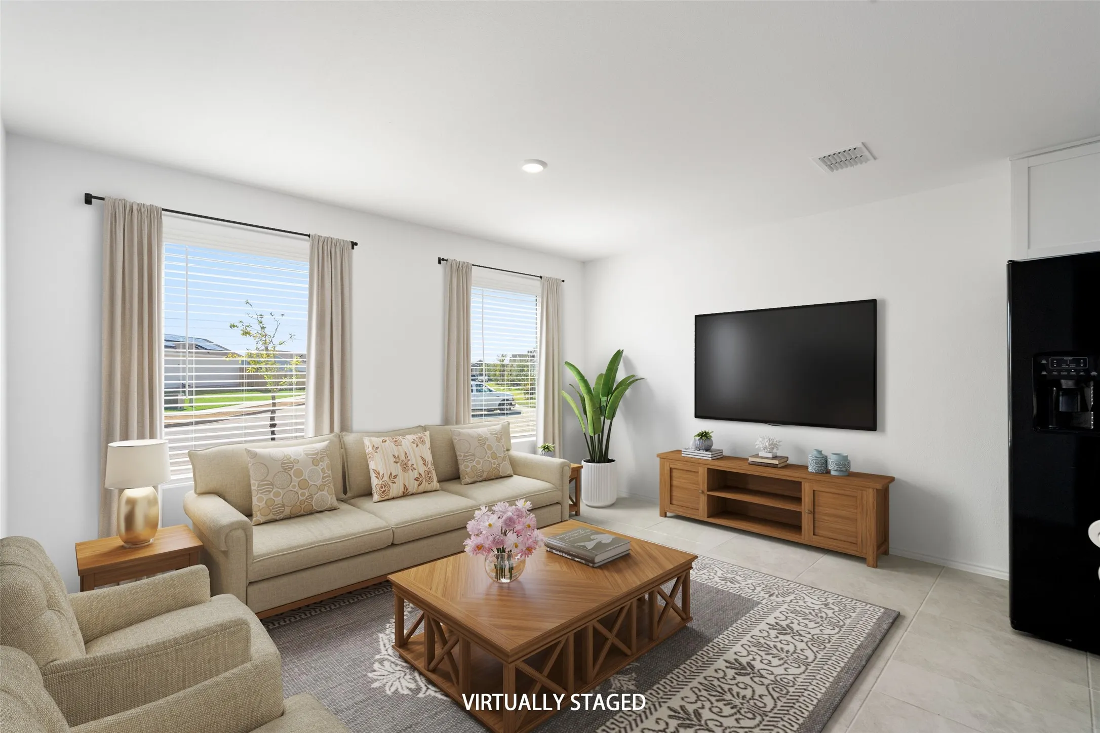 Bright interior with recessed lighting, large windows, tile flooring, and a built-in black appliance