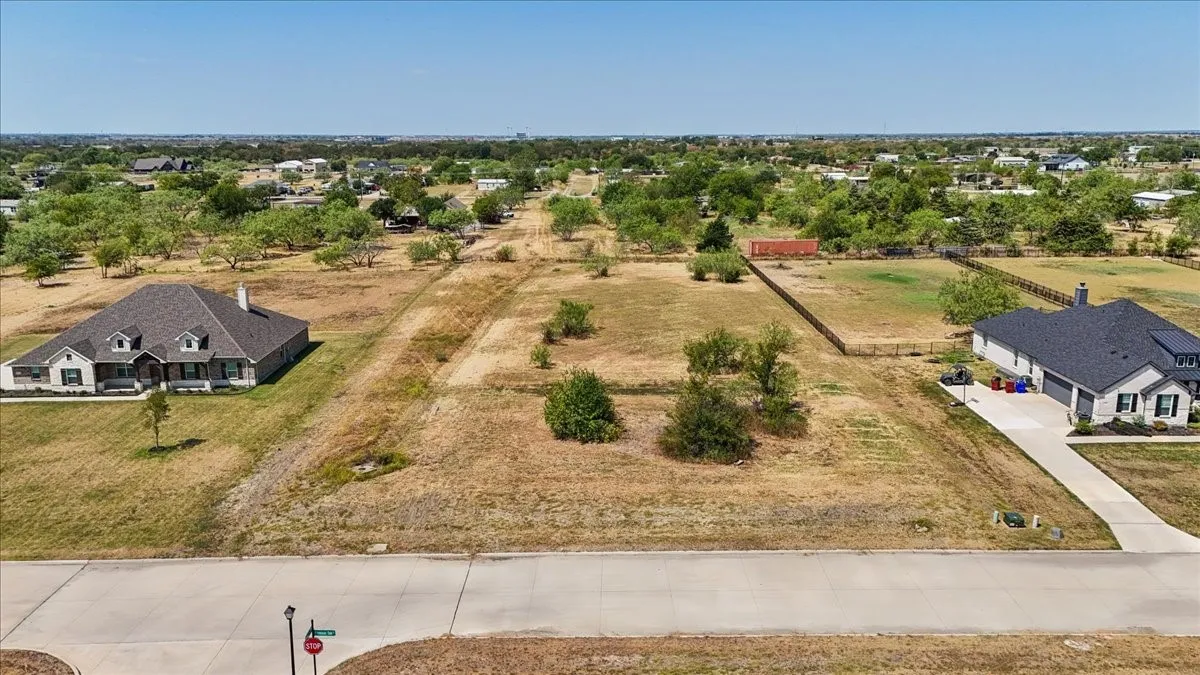 Expansive undeveloped lot featuring a paved road frontage