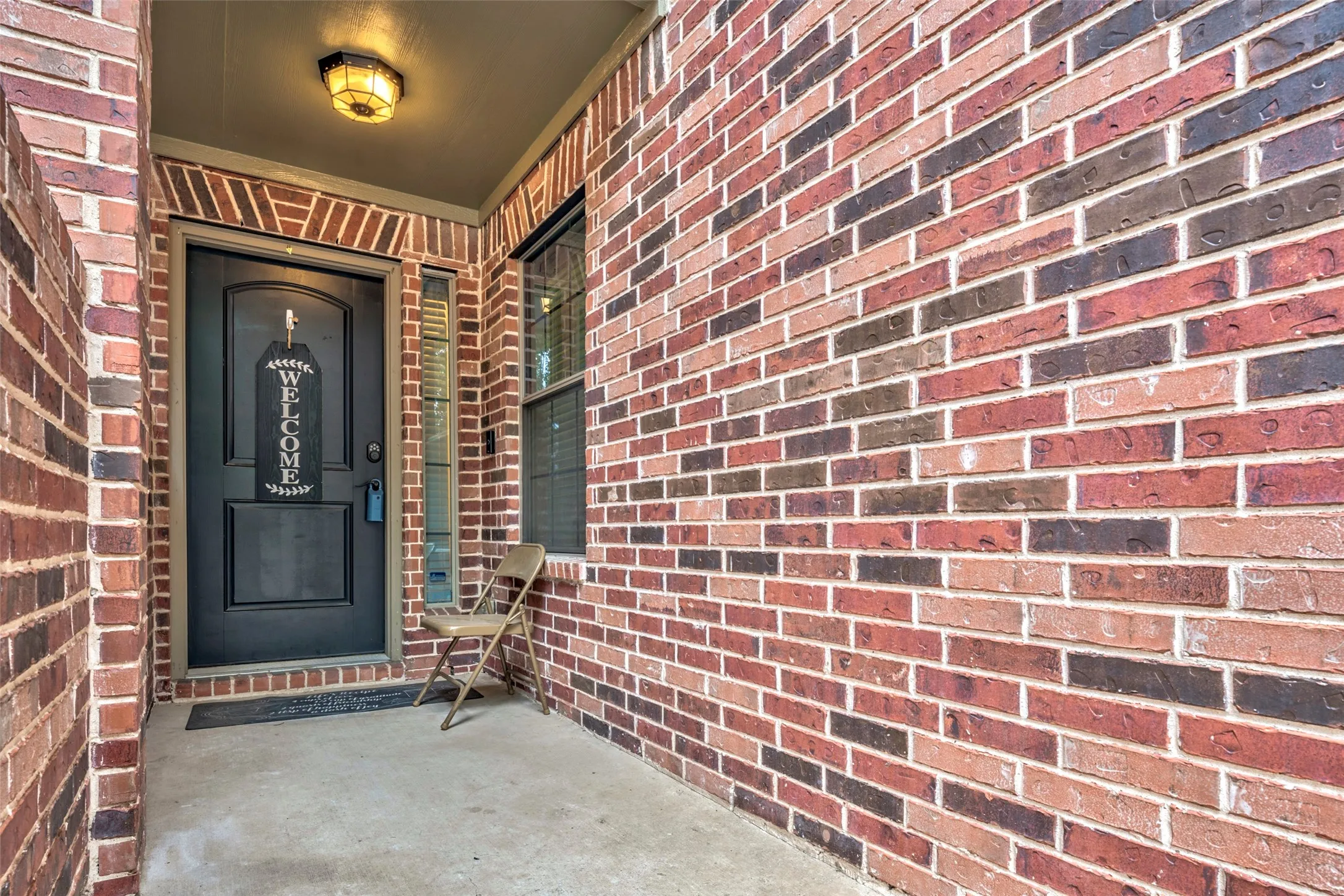Brick exterior with a covered entry