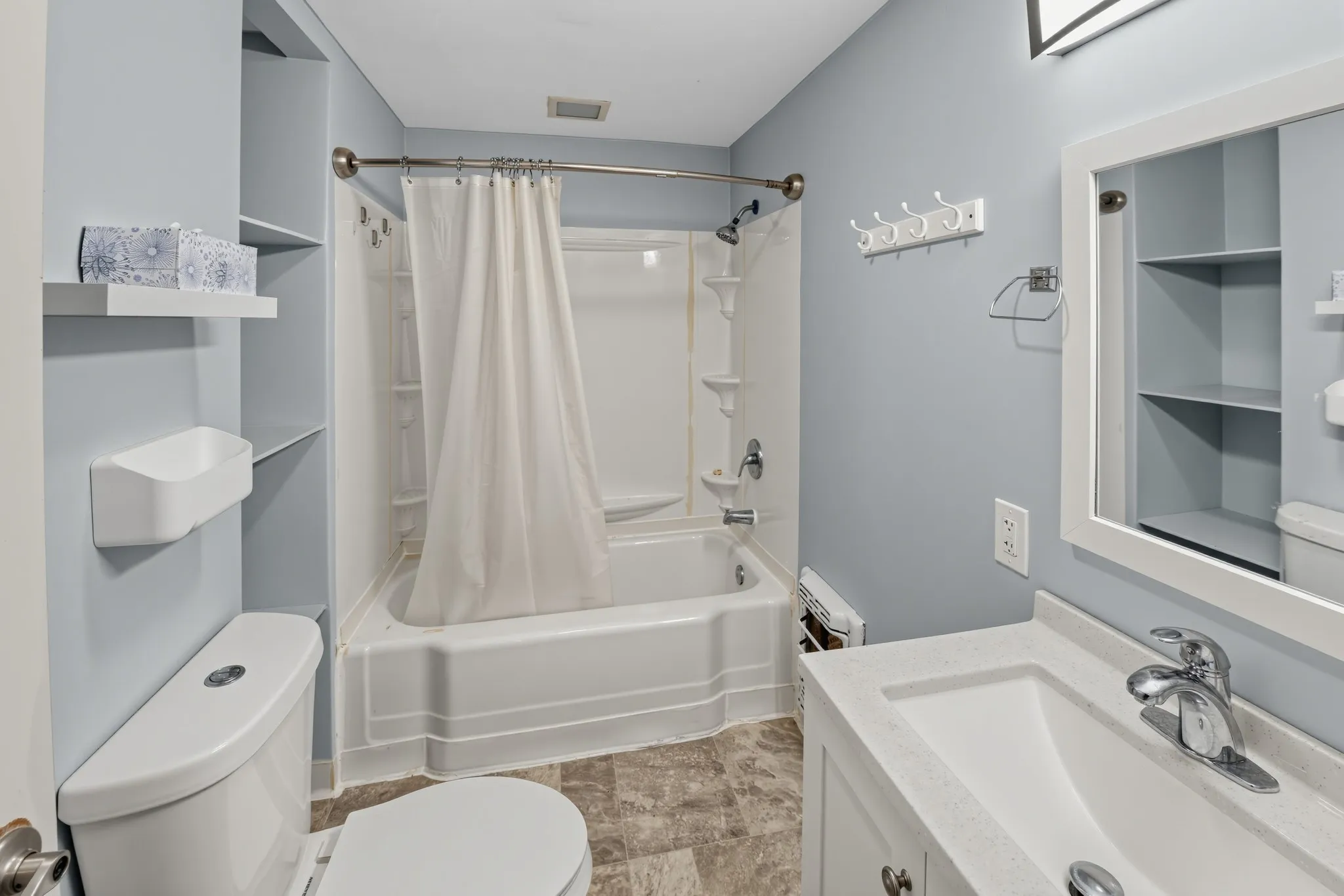 Vanity with an integrated sink and chrome fixtures