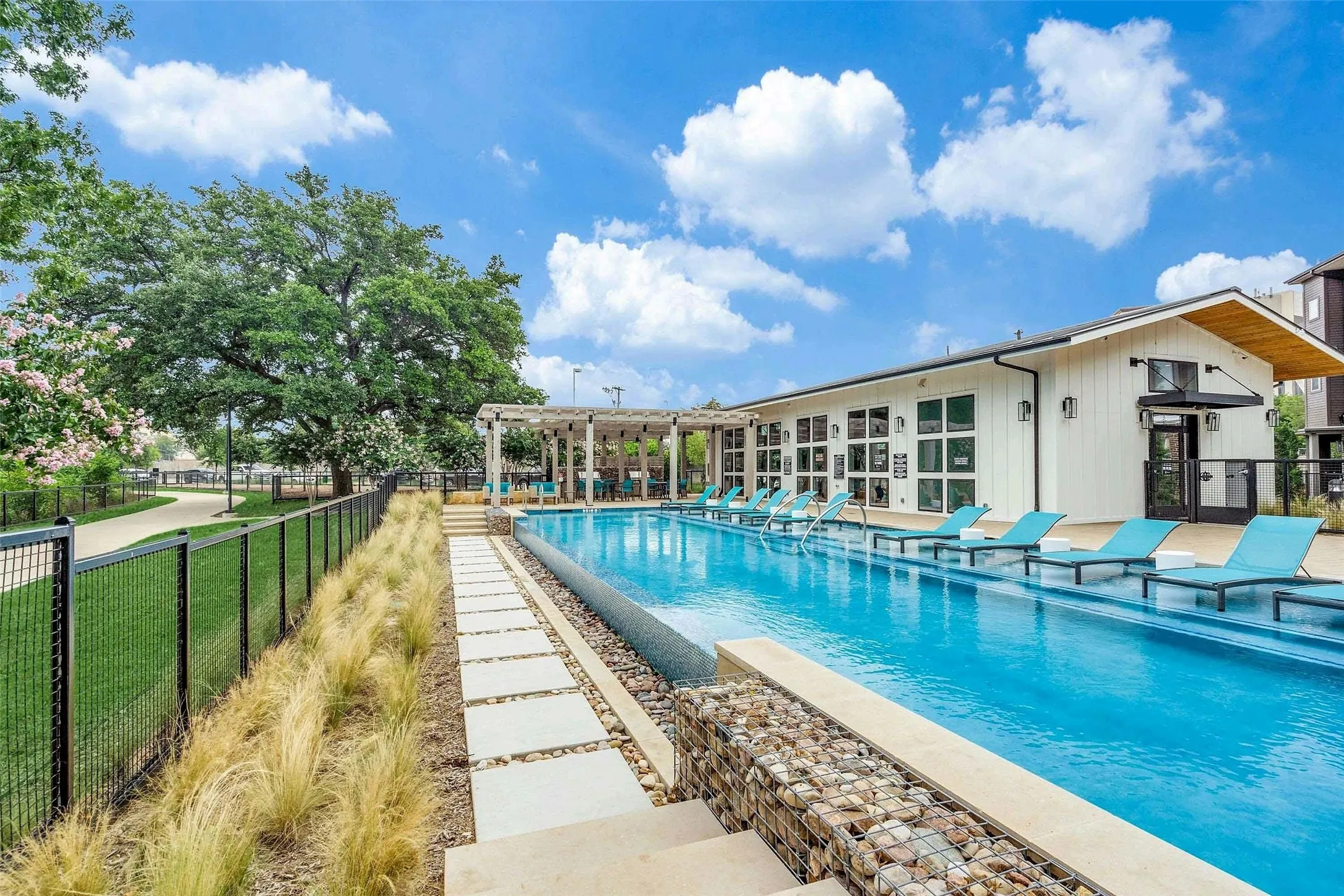 Community pool with a patio