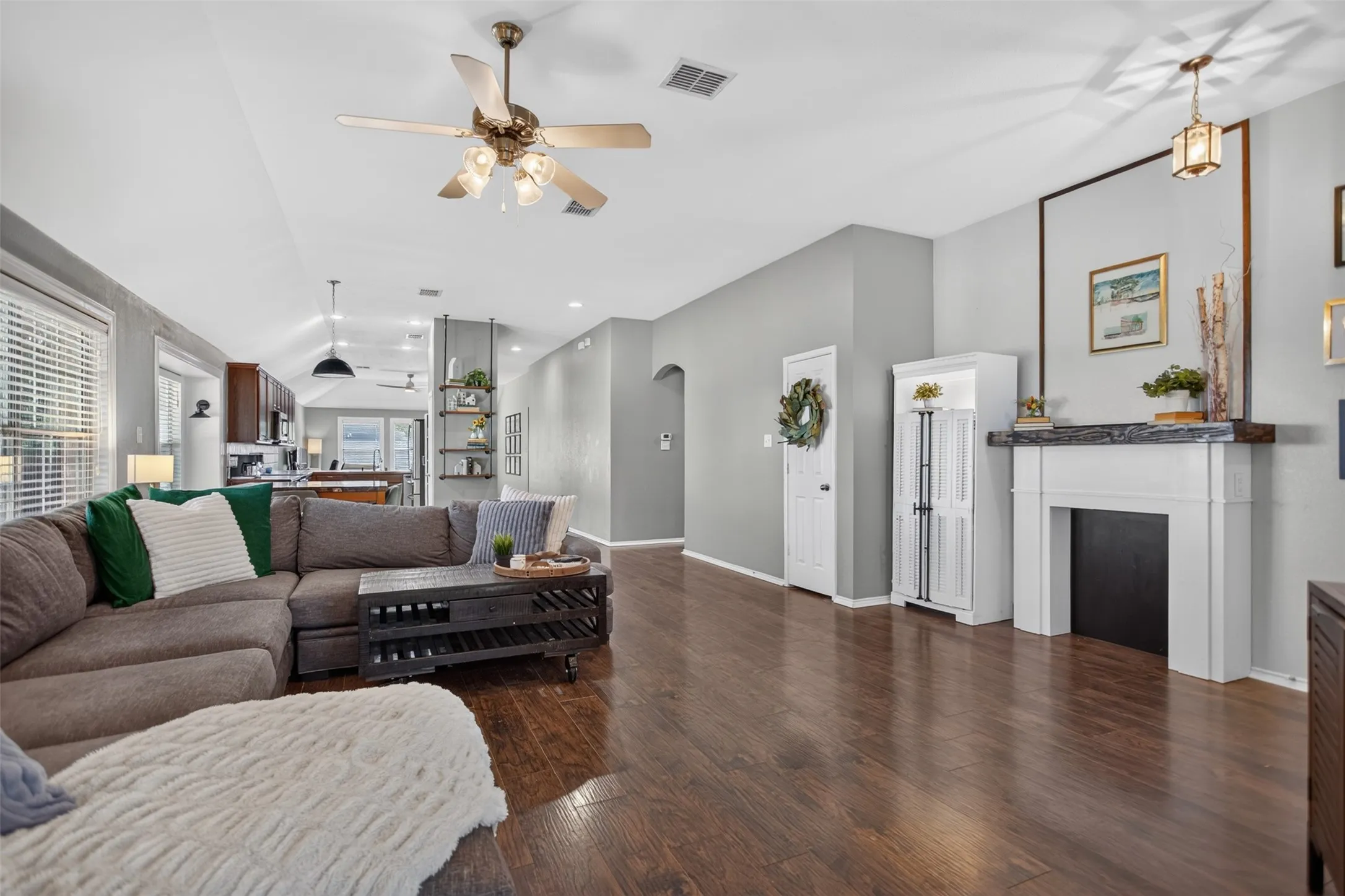 Huge open living space with laminate flooring and fresh paint