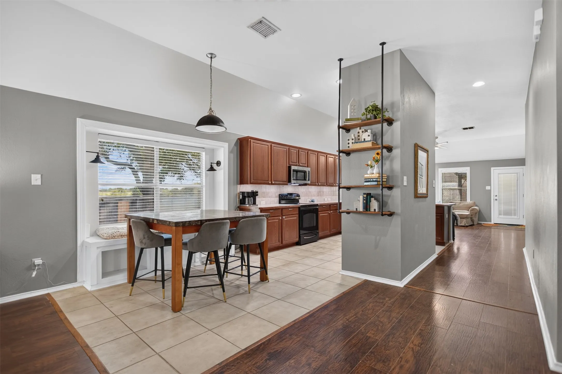 Living space opens to dining area and kitchn