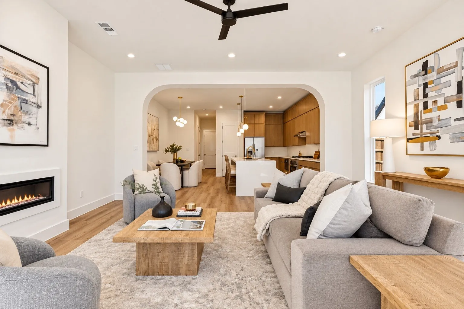 Living area with wood-finish flooring, recessed lighting, and an integrated fireplace