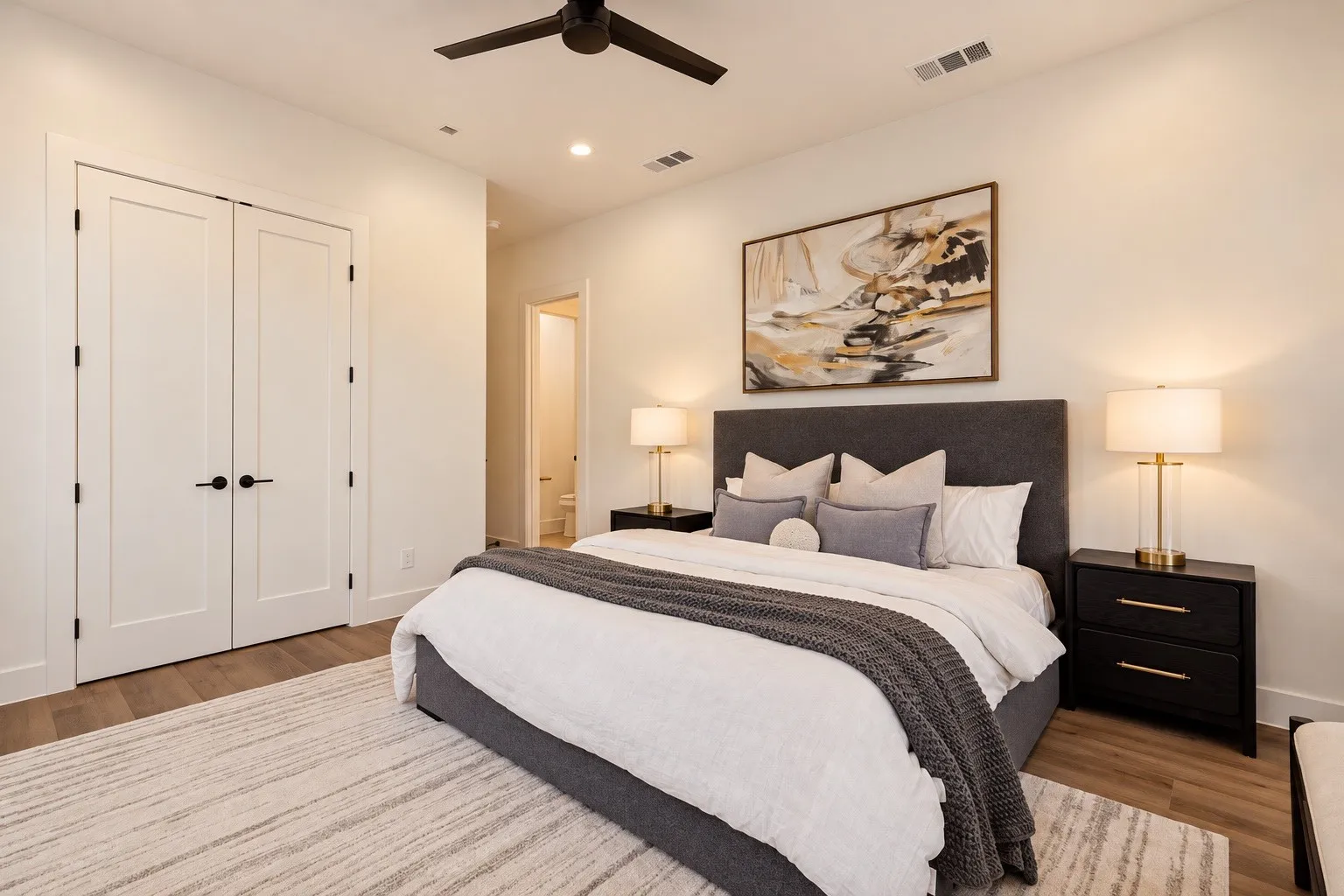 Recessed lighting, ceiling fan, wood-finish flooring, double panel doors, and neutral wall tones