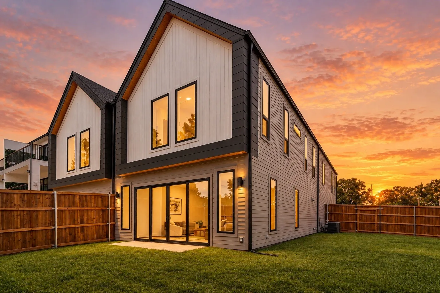 Modern architectural design featuring prominent gables and contrasting dark trim