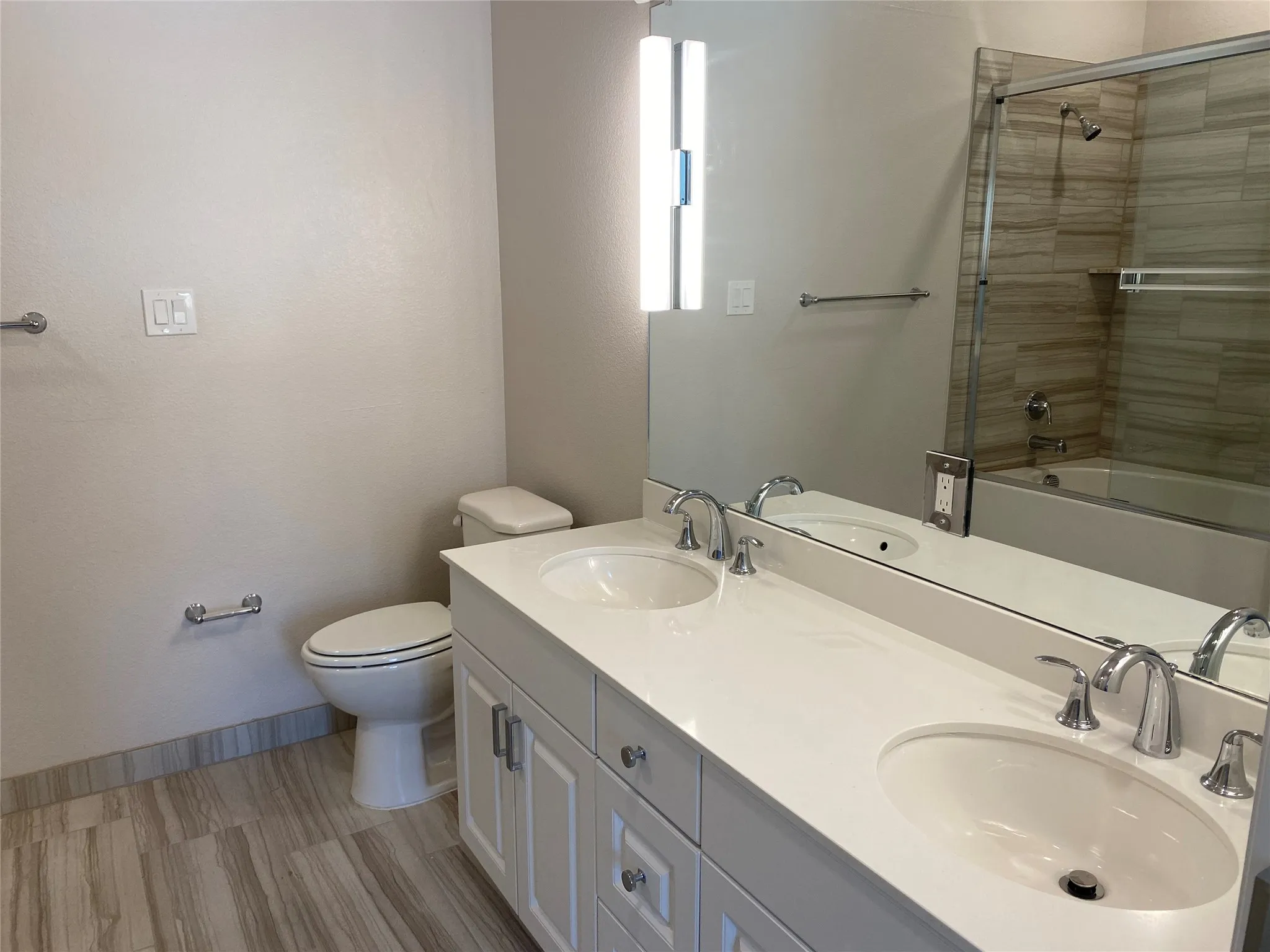 Dual vanity with undermount sinks and chrome fixtures