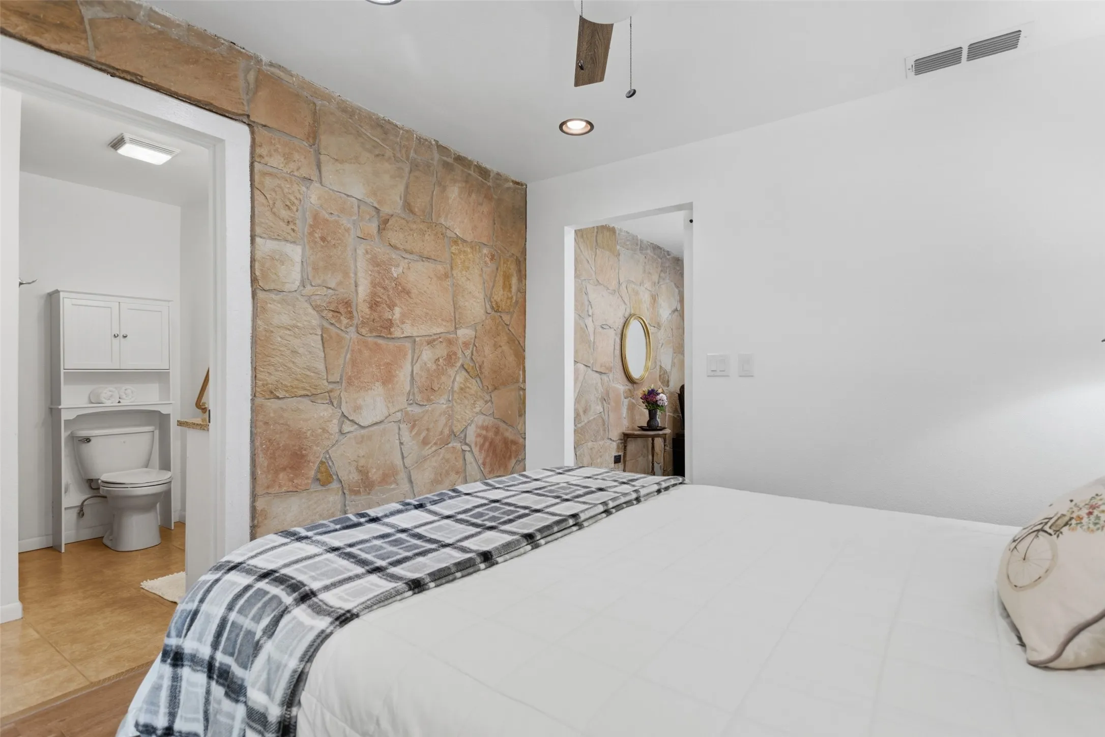 Accent stone wall with recessed lighting