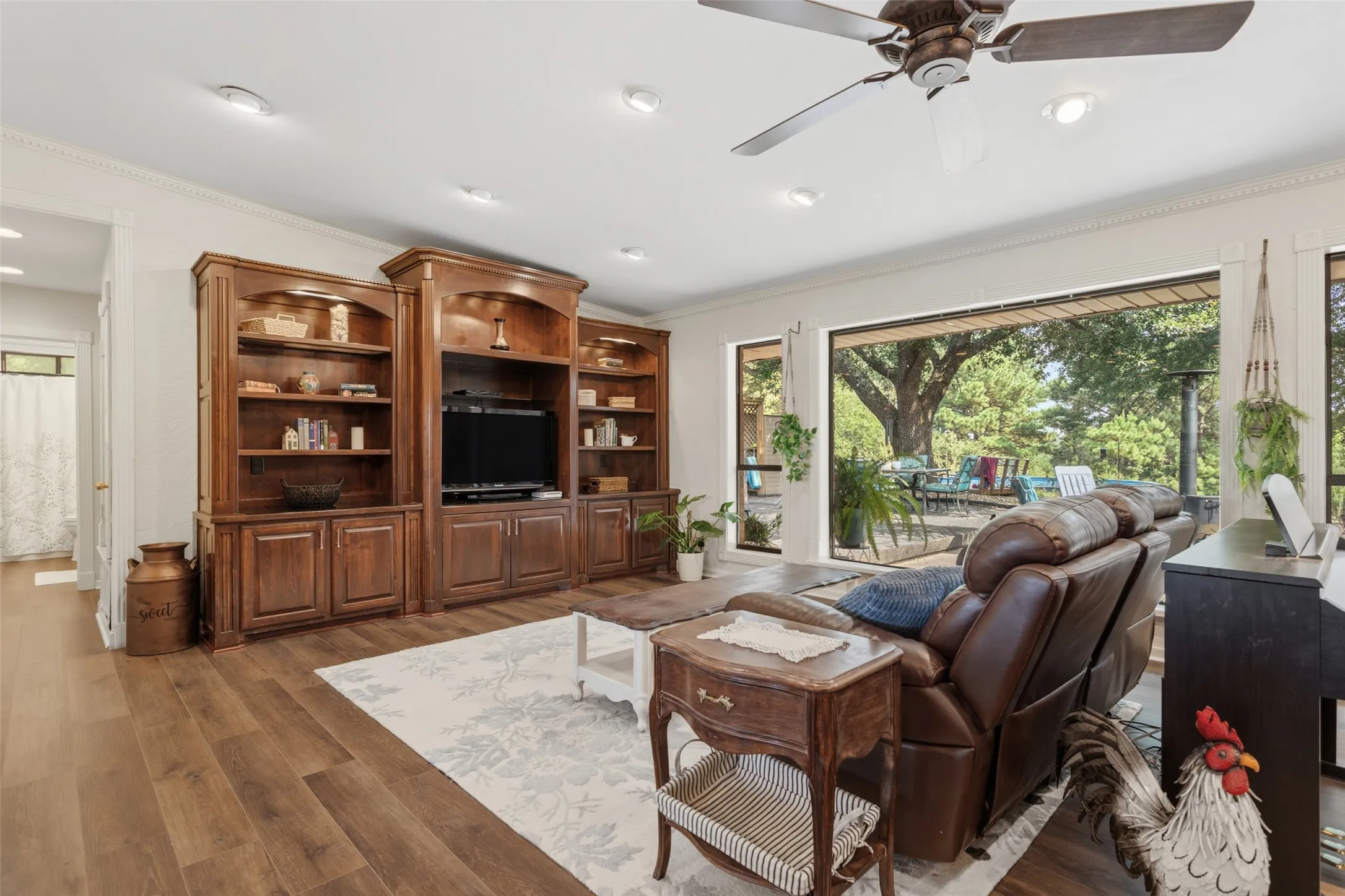 Wood-finish flooring, recessed lighting, and a ceiling fan