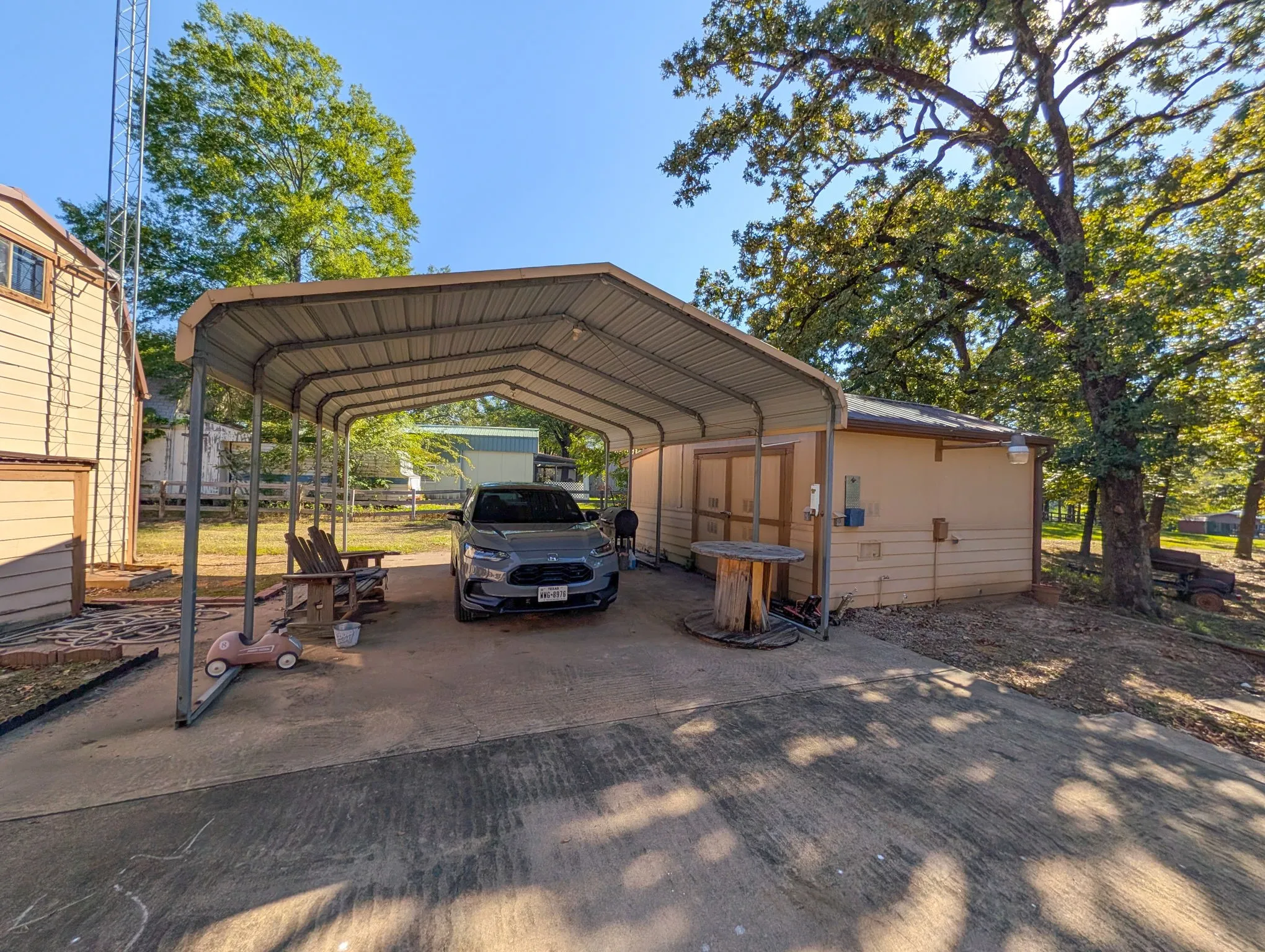 Carport with enough room for 4 cars Plus a storage building