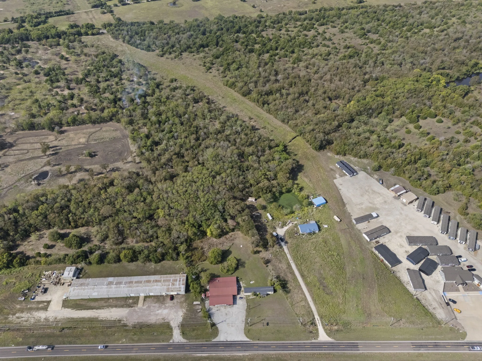 Expansive acreage featuring significant tree coverage and a dedicated utility easement