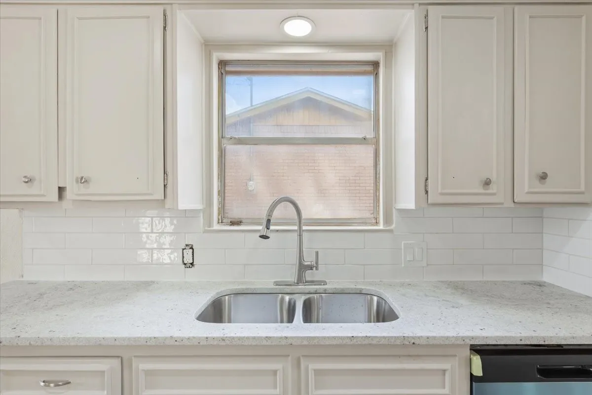 Clean up is a breeze with the new granite countertop and tile backsplash.
