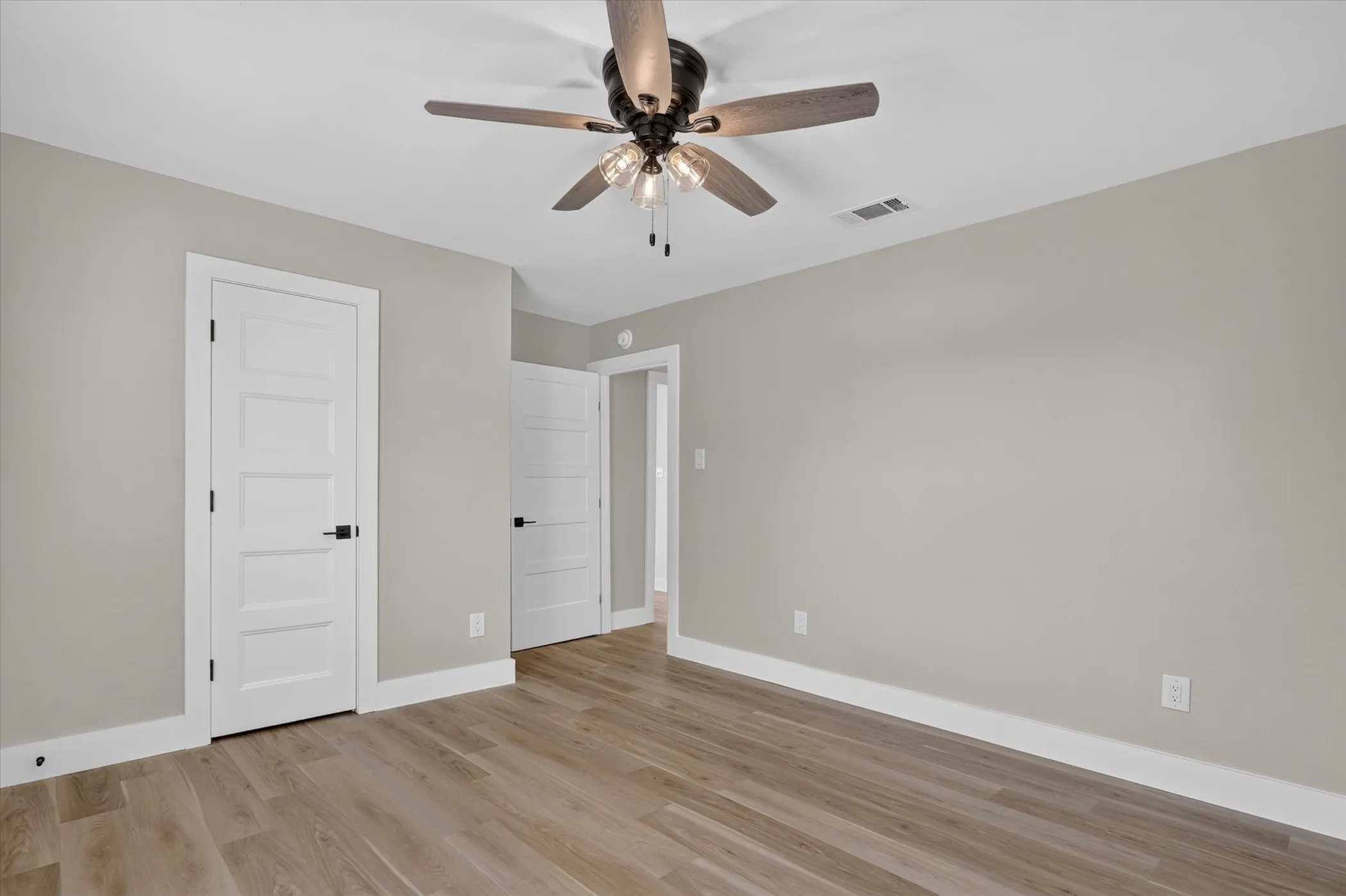 Wood-finish flooring with crisp white trim