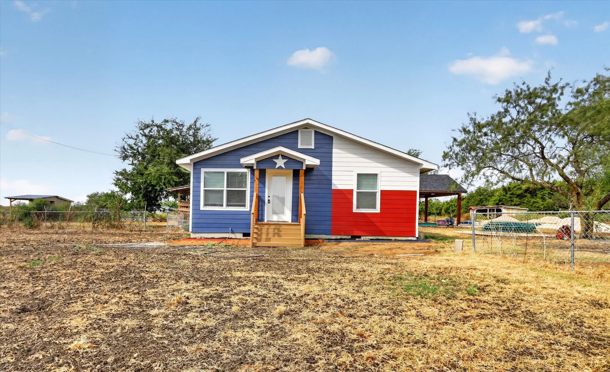 Exterior siding with a blue, white, and red color scheme