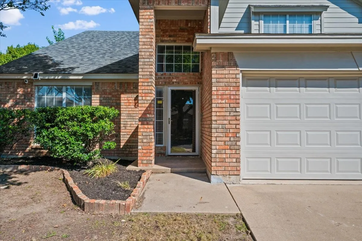Brick exterior with gray siding accents