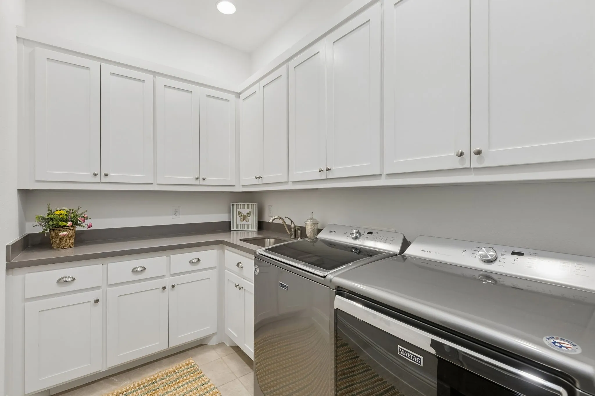 Downstairs Laundry Room, with exceptional storage space.