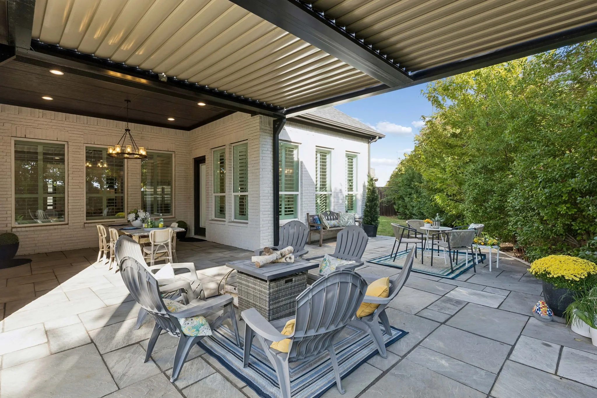 Electric Louver covered patio, Dining al fresco, Firepit, and a corner lot- plenty of room to add that sparkling pool.