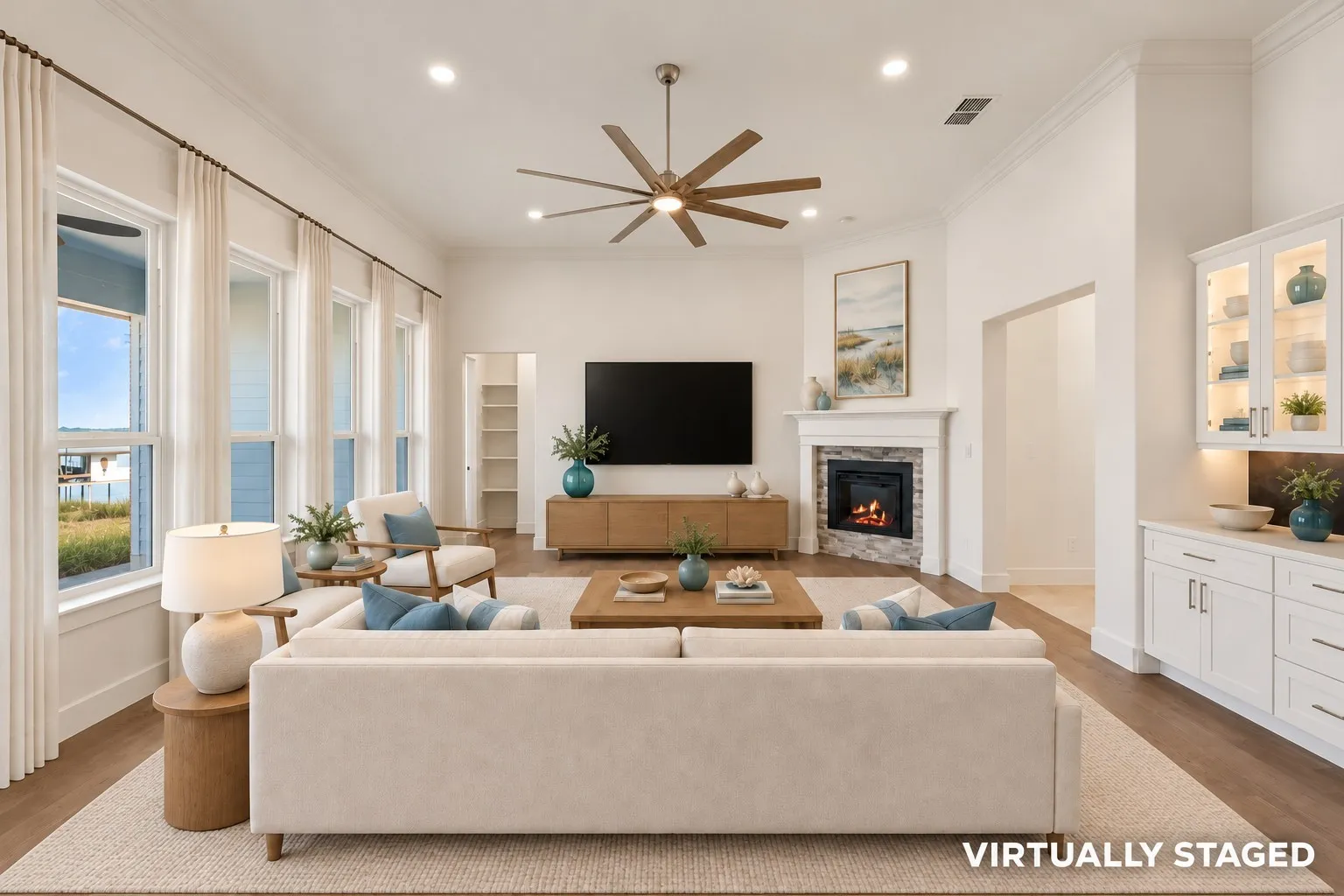 Virtually staged living room with electric fireplace and window view to Lake Richland Chambers shoreline.