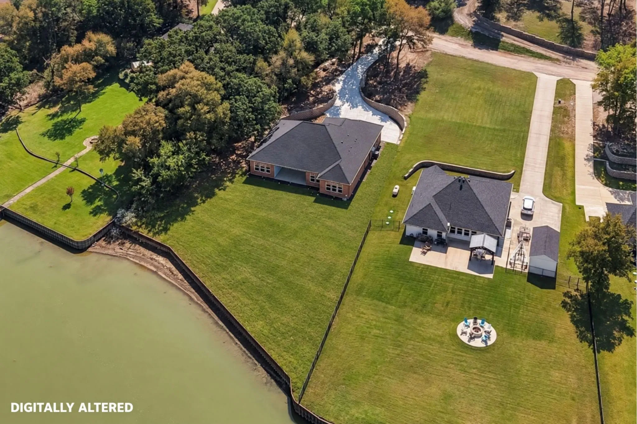 Digitally altered aerial view of shoreline to illustrate how the property will look after the grass has grown in.  Builder has grass seeded the lawn.