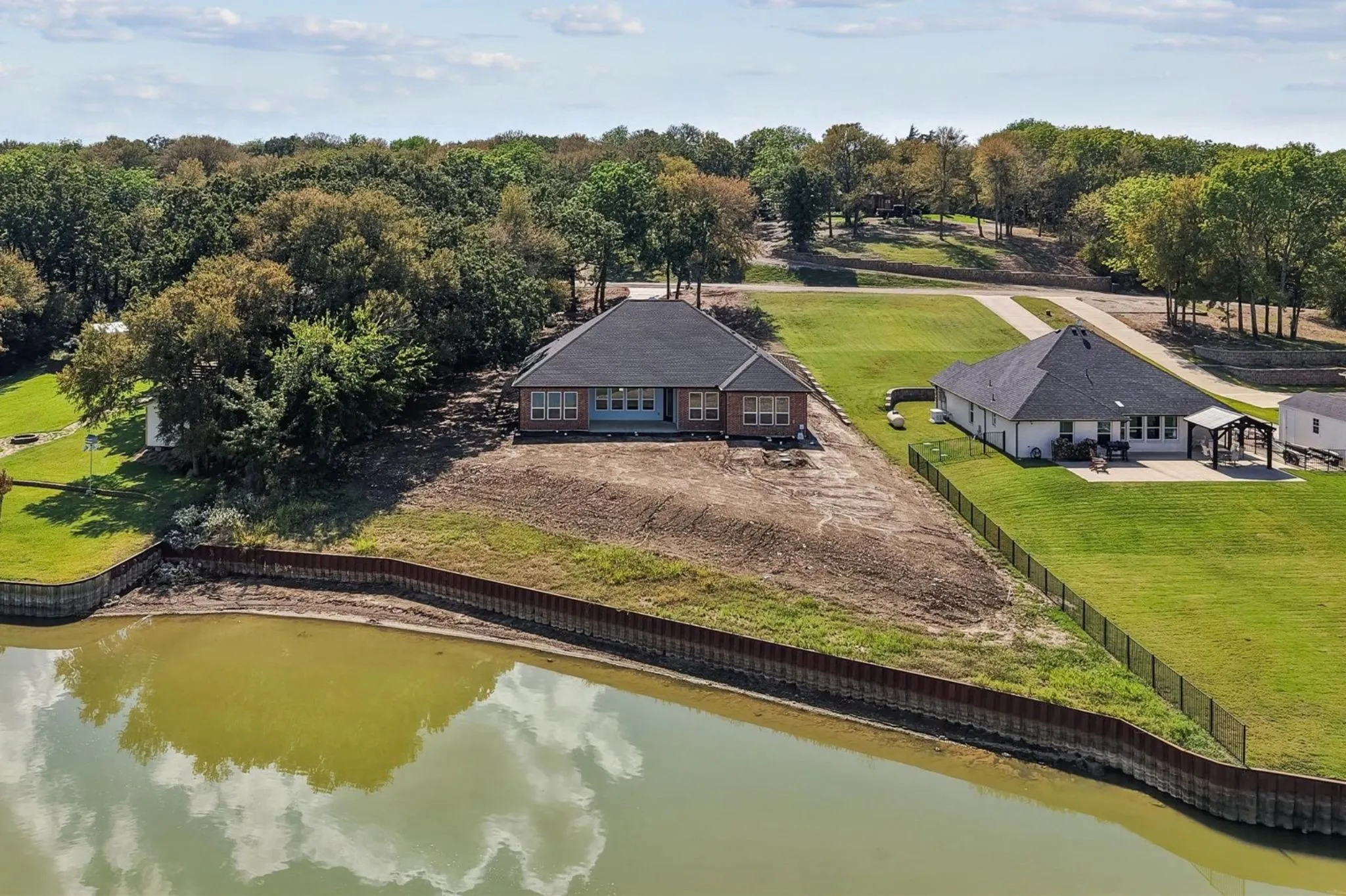 Aerial view of shoreline and steel retaining wall.