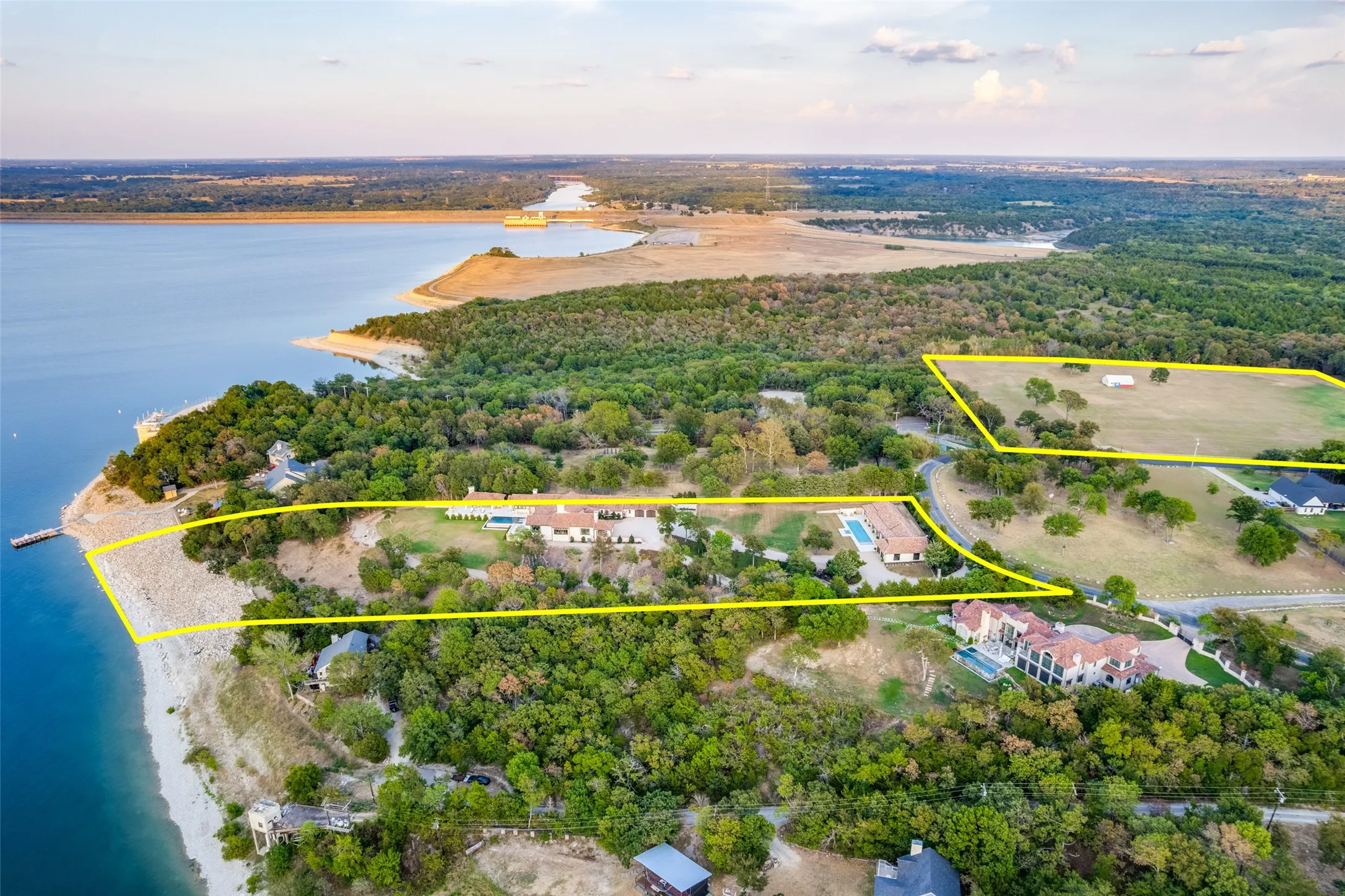Expansive acreage with waterfront access, multiple residences, and a private swimming pool