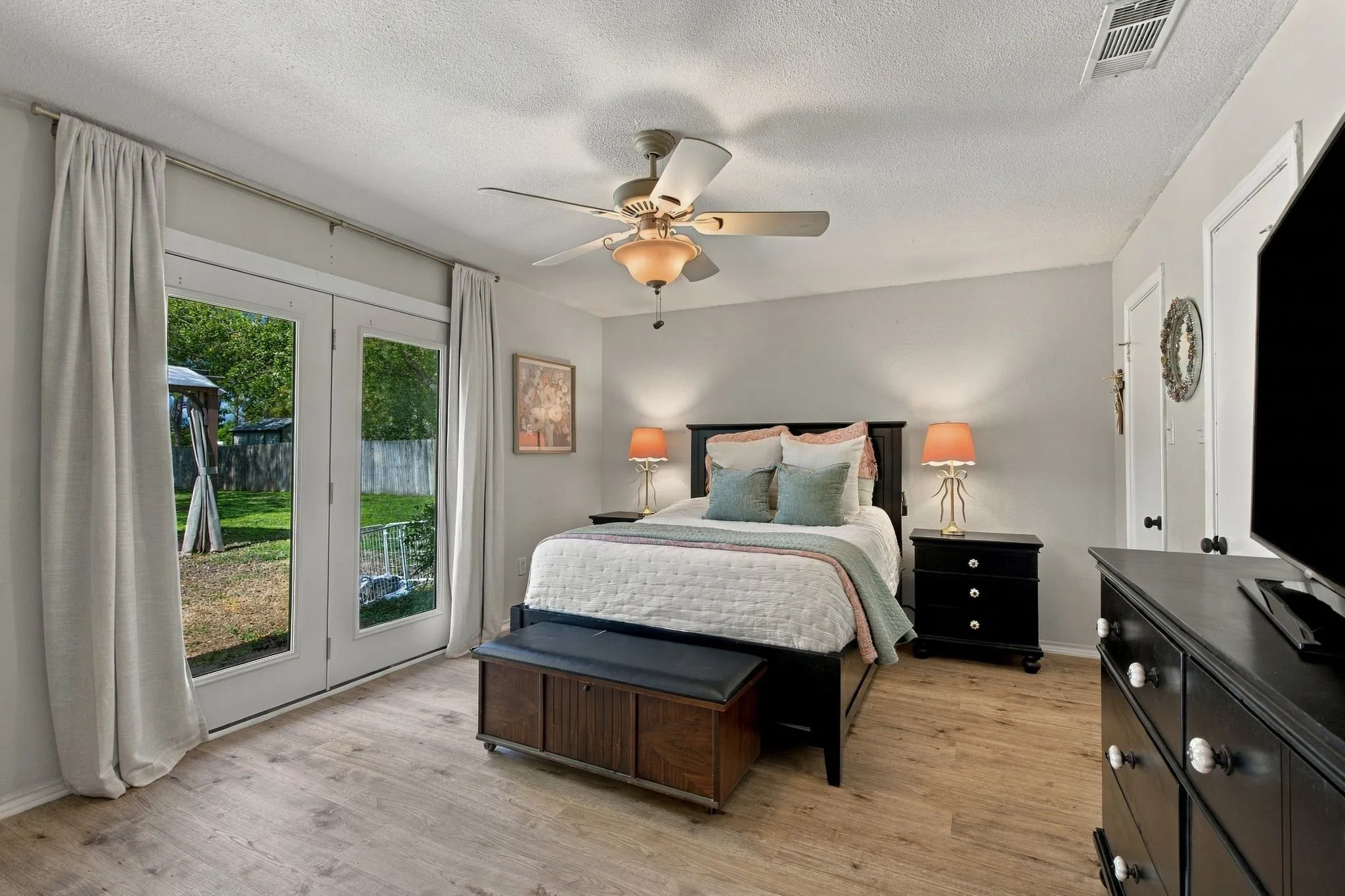 Primary bedroom with walk-out to pool.