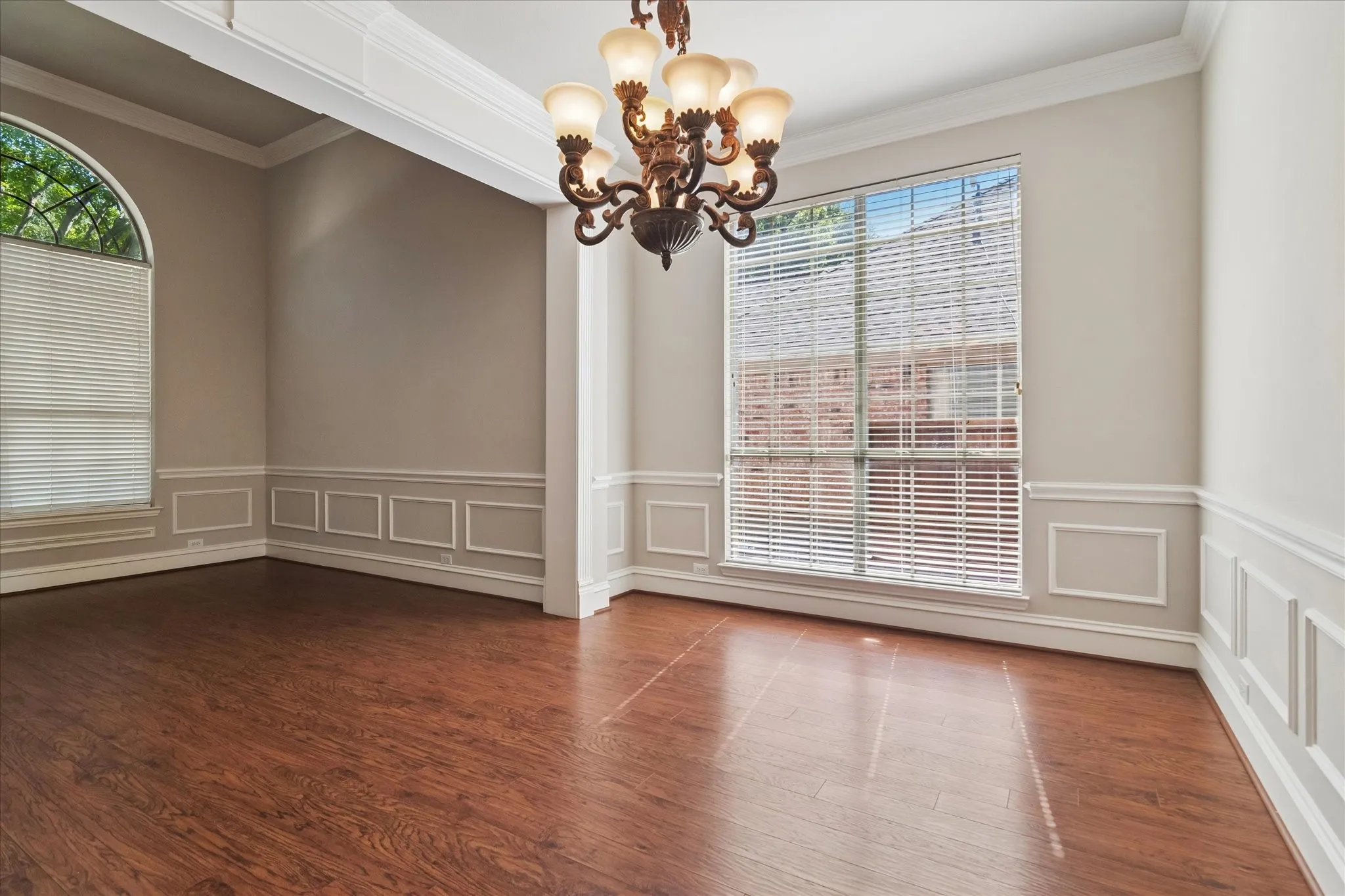 Wood-finish flooring with decorative wainscoting and crown molding