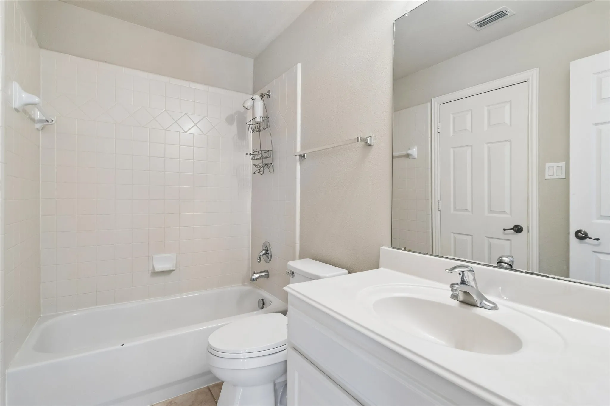 White vanity with an integrated sink and chrome faucet