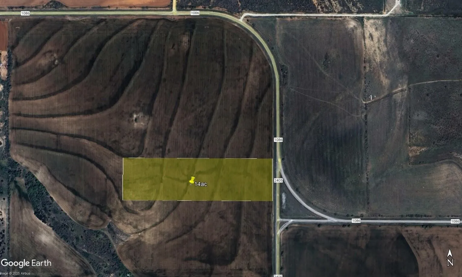 Aerial Map. Displaying a parcel of land, approximately 14 acres, marked in yellow, with adjacent roadways and surrounding terrain
