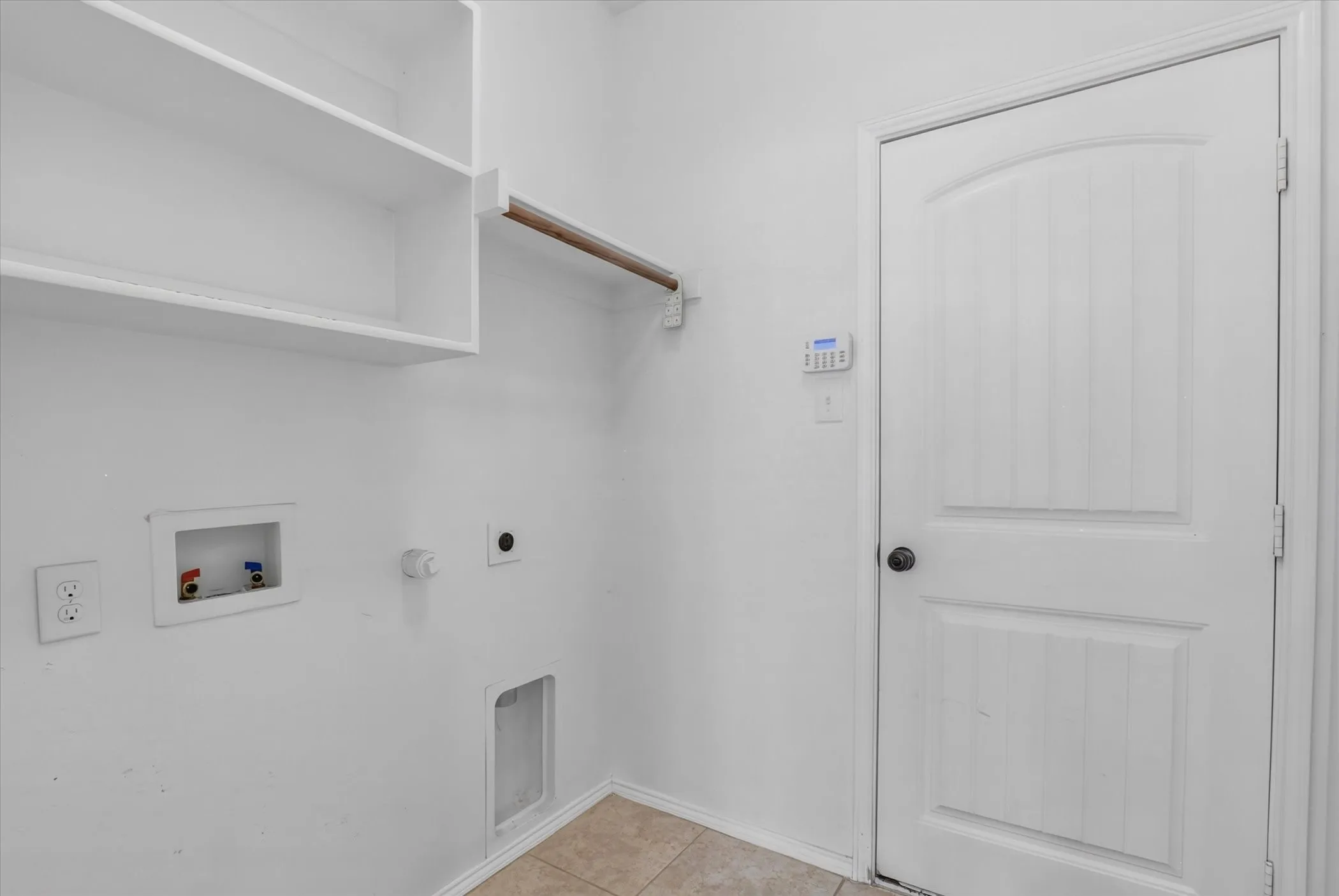 Built-in shelving, hanging rod, and utility connections