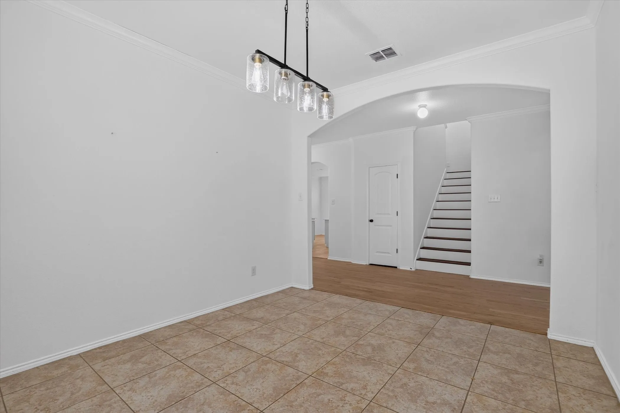 Tile flooring paired with wood-finish flooring