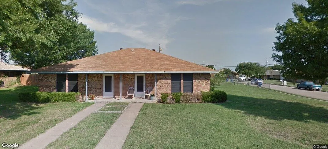 Brick exterior, brown shingle roof, dual front entrances, concrete driveways, and established landscaping