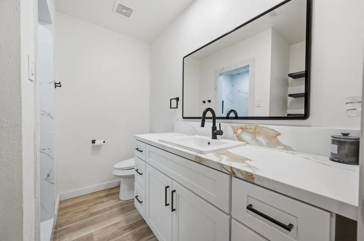 Bathroom #3 with quartz countertop and walk-in shower