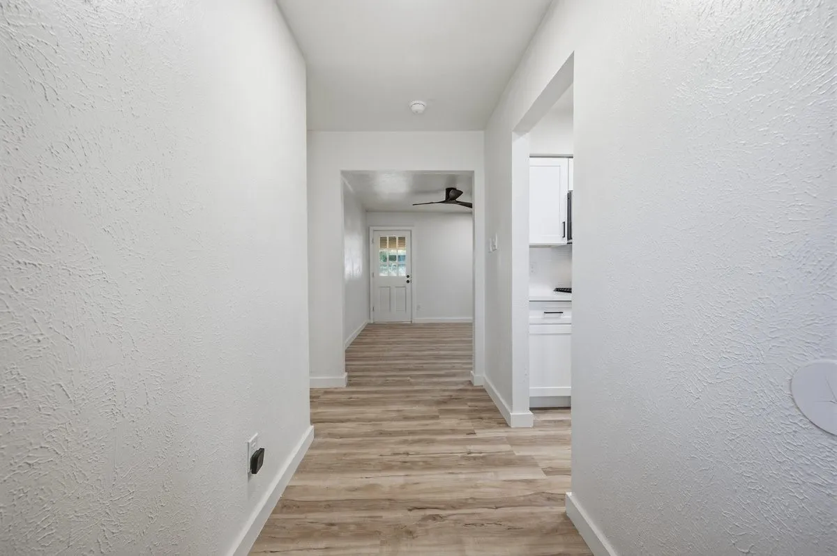Entry hall with kitchen to the right