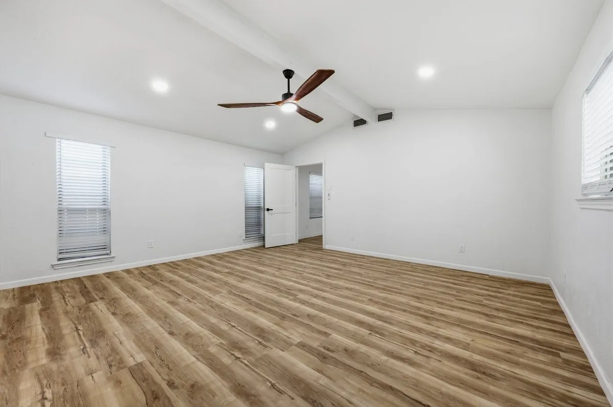 Note the vaulted ceiling in this spacious primary bedroom