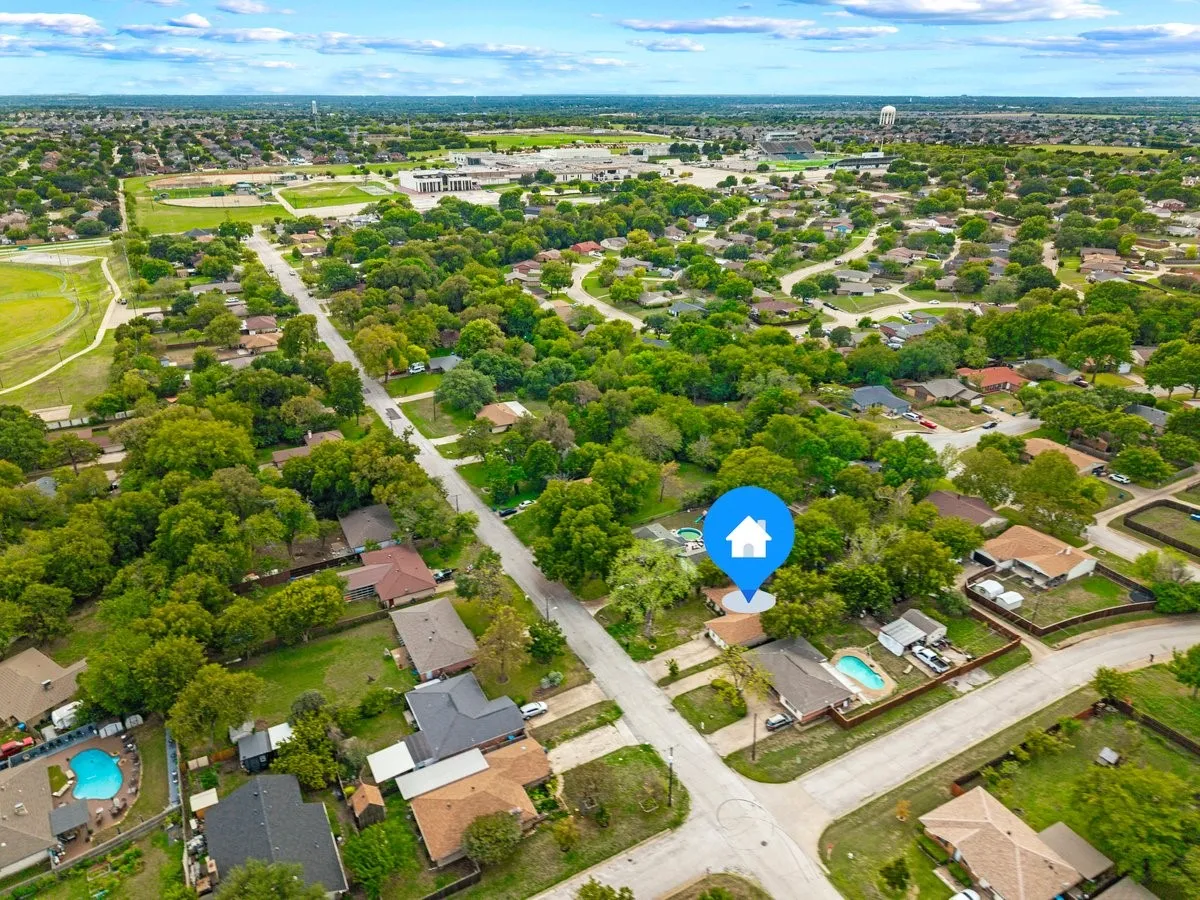 Aerial perspective  featuring mature trees situated within a suburban neighborhood